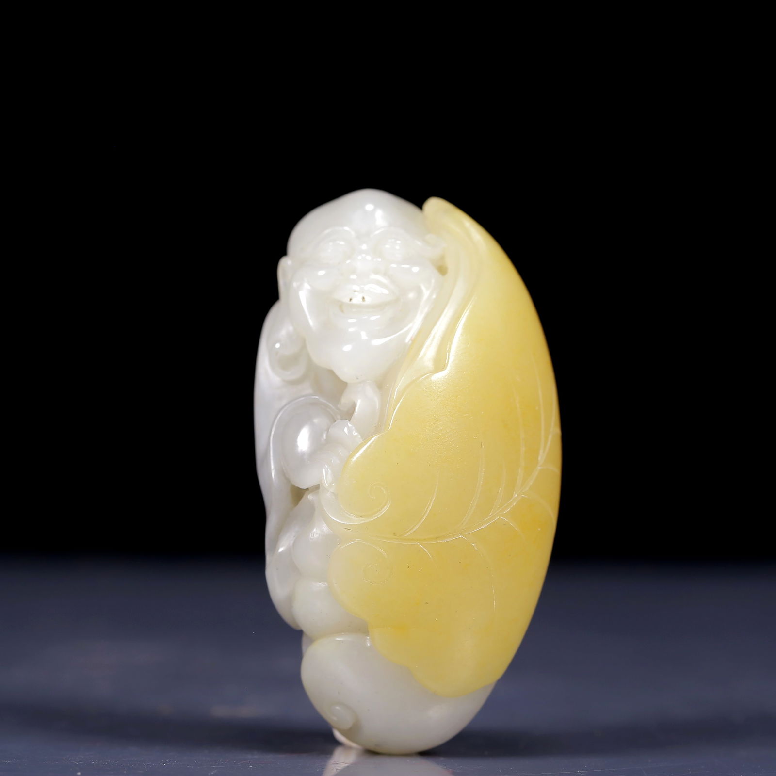 An Exquisite White Jade Arhat Ornament: An Exquisite White Jade Arhat Ornament,Qing Dynasty, China,Size: 3inx1.6inx1in,Weight:145g 白玉罗汉像摆件，清代