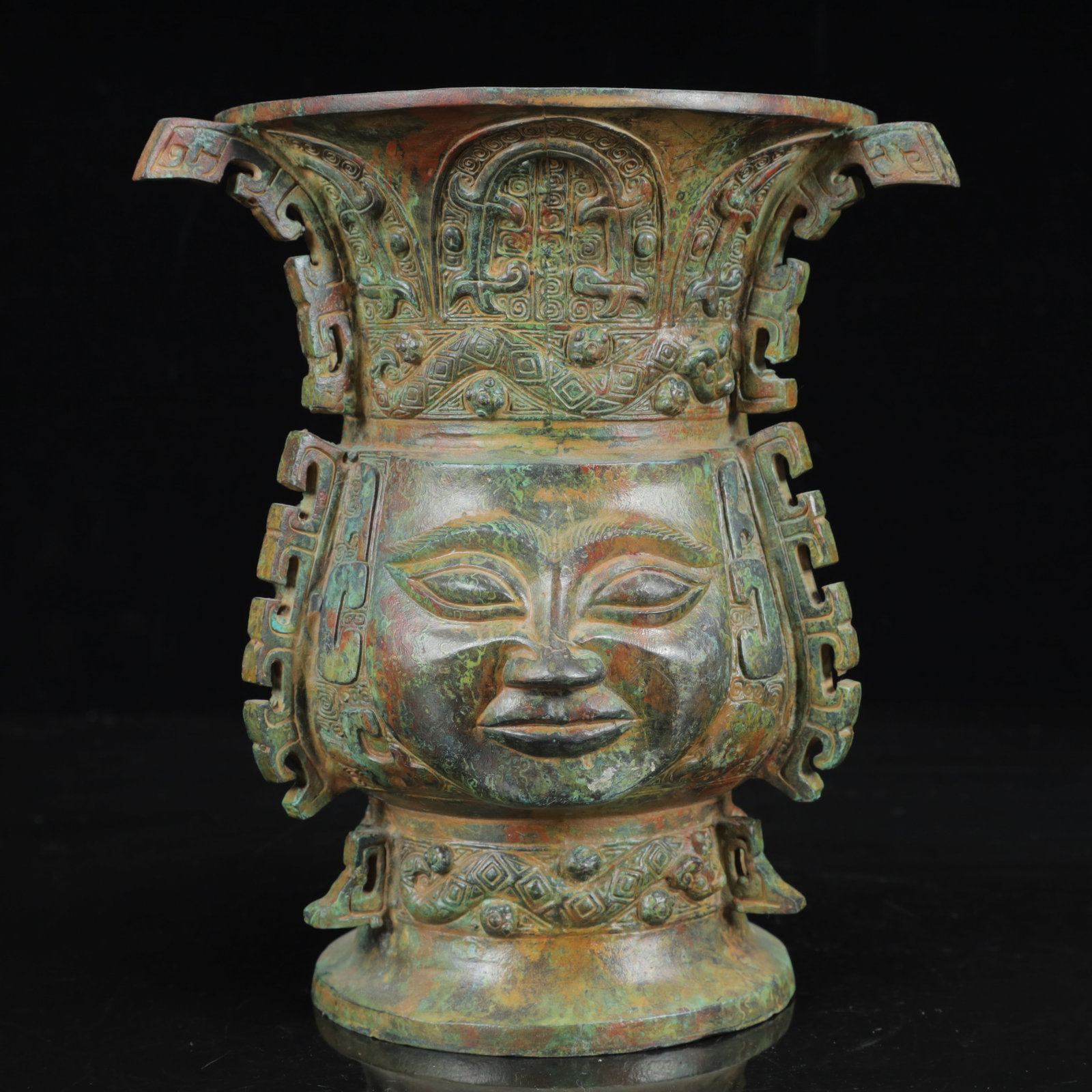 An Archaic Bronze Figure-Face Pattern Four Ears Vase: An Archaic Bronze Figure-Face Pattern Four Ears Vase,the Warring States Period in China,Size:7.1inx8.3in,Weight:1950g 