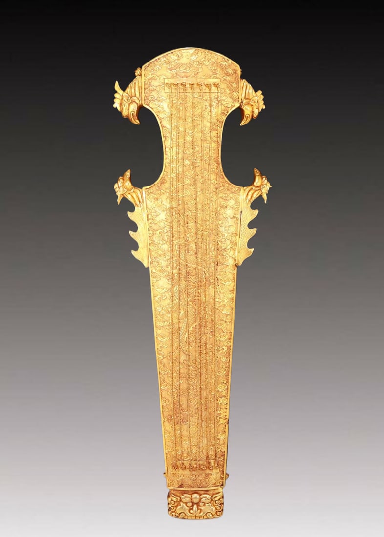 A Magnificent Gilt-Bronze 'Auspicious Cloud& Dragon' Zither-Form Decoration: A Magnificent Gilt-Bronze 'Auspicious Cloud& Dragon' Zither-Form Decoration. Cast with a sinuous, scaly dragon writhing amidst dense clouds. Chinese Qing Dynasty. Qianlong Four-Character Mark.