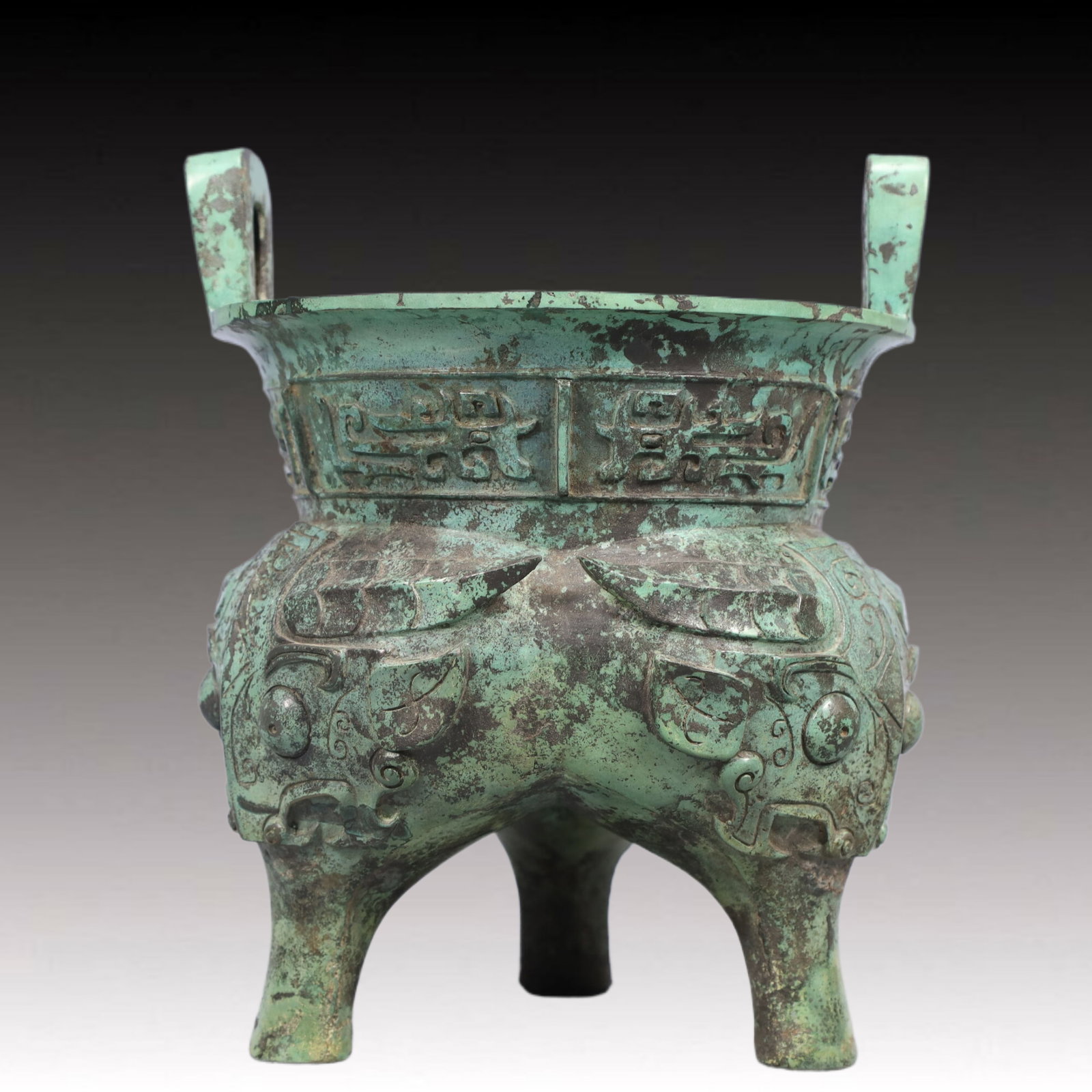 A Precious Bronze Beast-Face Pattern Double-Ears and Tripod Censer: A Precious Bronze Beast-Face Pattern Double-Ears and Tripod Censer,Ancient Time, China,Size: 7.5inx9.1in ;Weight: 2450g 