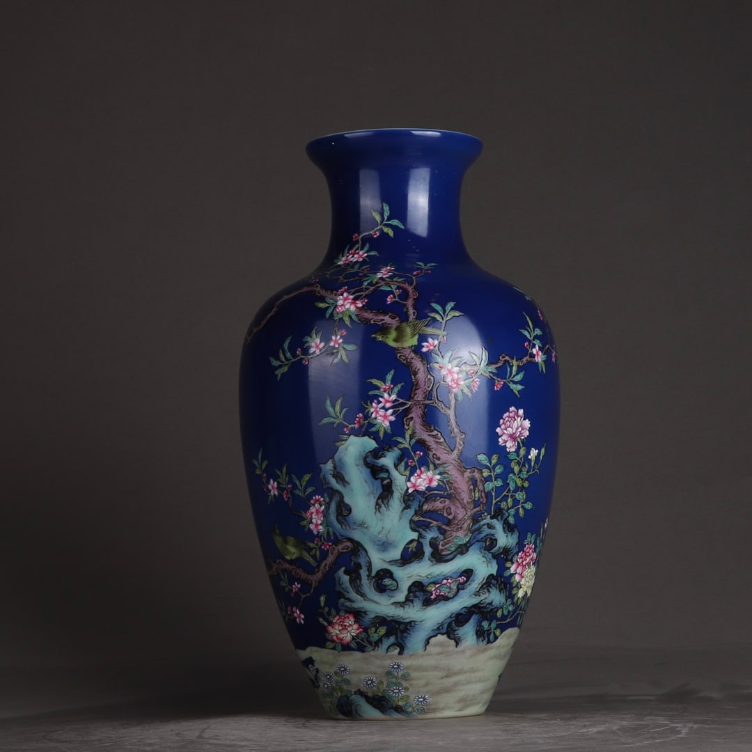 An Exquisite Sapphire Blue Glazed Famille-Rose Flower and Bird Pattern Vase: An Exquisite Sapphire Blue Glazed Famille-Rose Flower and Bird Pattern Vase,Qing Dynasty,China,Qianlong Four-character Mark,Size:12.2inx6.9in 