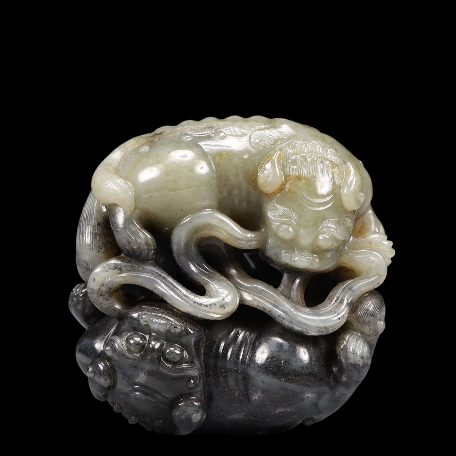 An Exquisite Greenish Jade Lion Ornament (1 of 6)