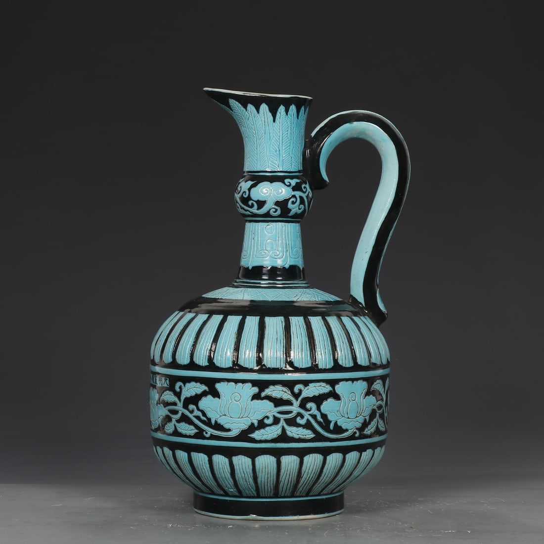An Exquisite Ink Ground Blue Glazed Flower Pattern Watering Can: An Exquisite Ink Ground Blue Glazed Flower Pattern Watering Can,Ming Dynasty,China,Size:10.8inx6.1in 墨地蓝彩花卉纹花浇,中国明&#
