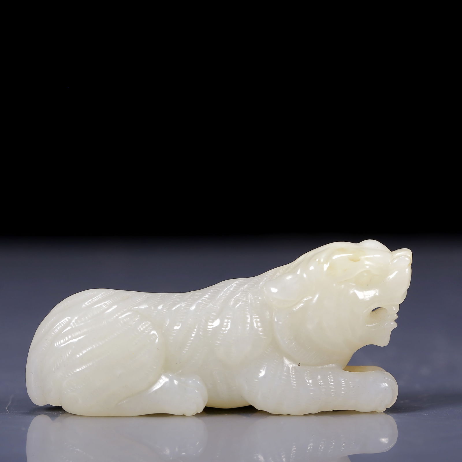 An Exquisite White Jade Tiger Ornament (1 of 6)