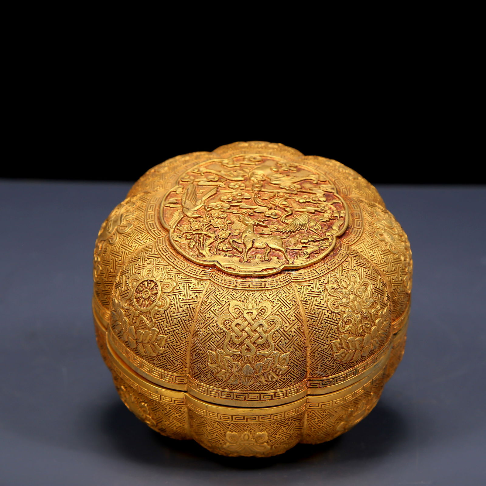An Exquisite Gilt Bronze Eight Treasures and Auspicious Beast Pattern Box: An Exquisite Gilt Bronze Eight Treasures and Auspicious Beast Pattern Box，Qing Dynasty, China，Qianlong Four-character Mark，Size:5.1inx3.9in，Weight:1135g 