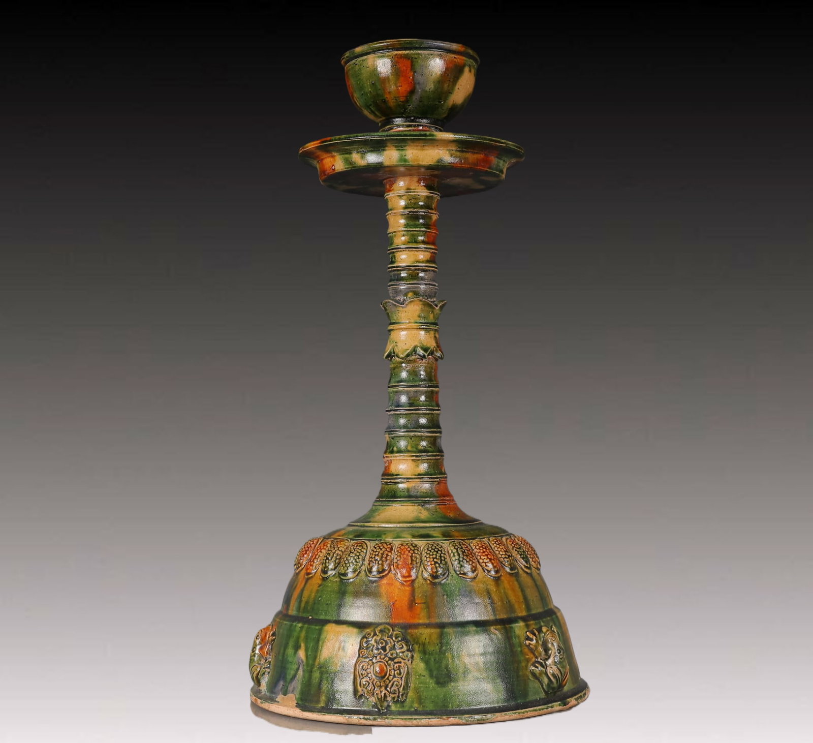 A Huge Tang Tri-Color Glazed Pottery Flower Pattern Candlestick: A Huge Tang Tri-Color Glazed Pottery Flower Pattern Candlestick,Tang Dynasty, China,Size:9.8inx9.8inx18.9in,Weight:3050g 唐三彩花卉纹烛台，中