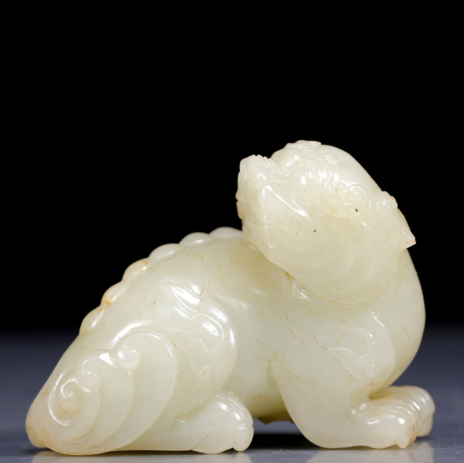 An Exquisite White Jade Lion Ornament: An Exquisite White Jade Lion Ornament,Qing Dynasty, China,Size:3.1inx1.6inx2.4in,Weight:245g 白玉狮子摆件，清代