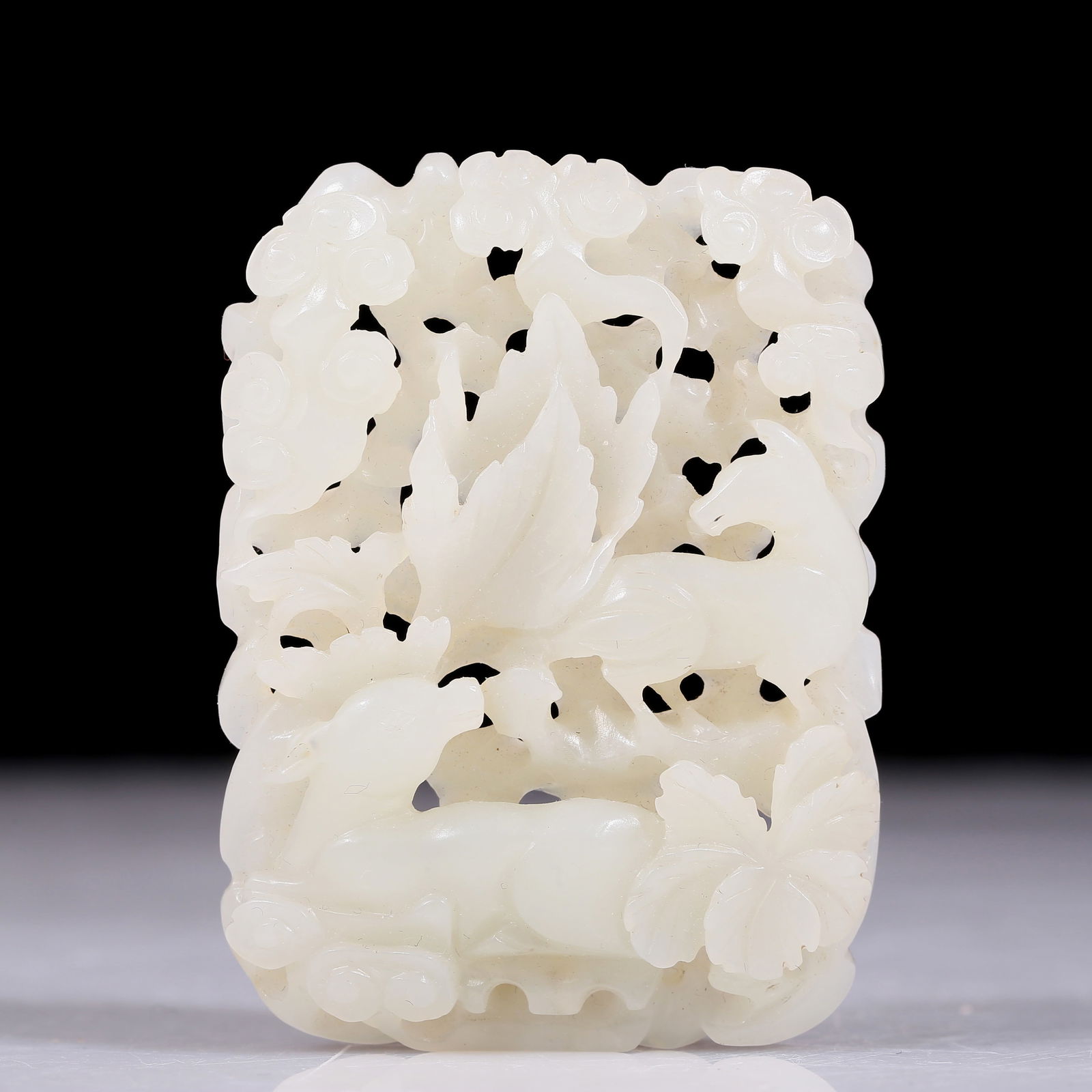 An exquisite white jade ornament with floral and auspicious animal patterns (1 of 4)