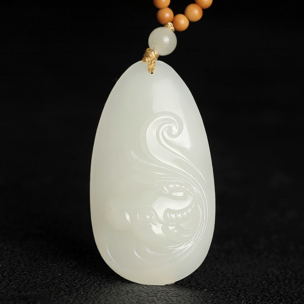 An Exquisite White Jade Buffalo Pattern Pendant: An Exquisite White Jade Buffalo Pattern Pendant,Size:1.4inx0.7inx0.3in 白玉牛纹挂件