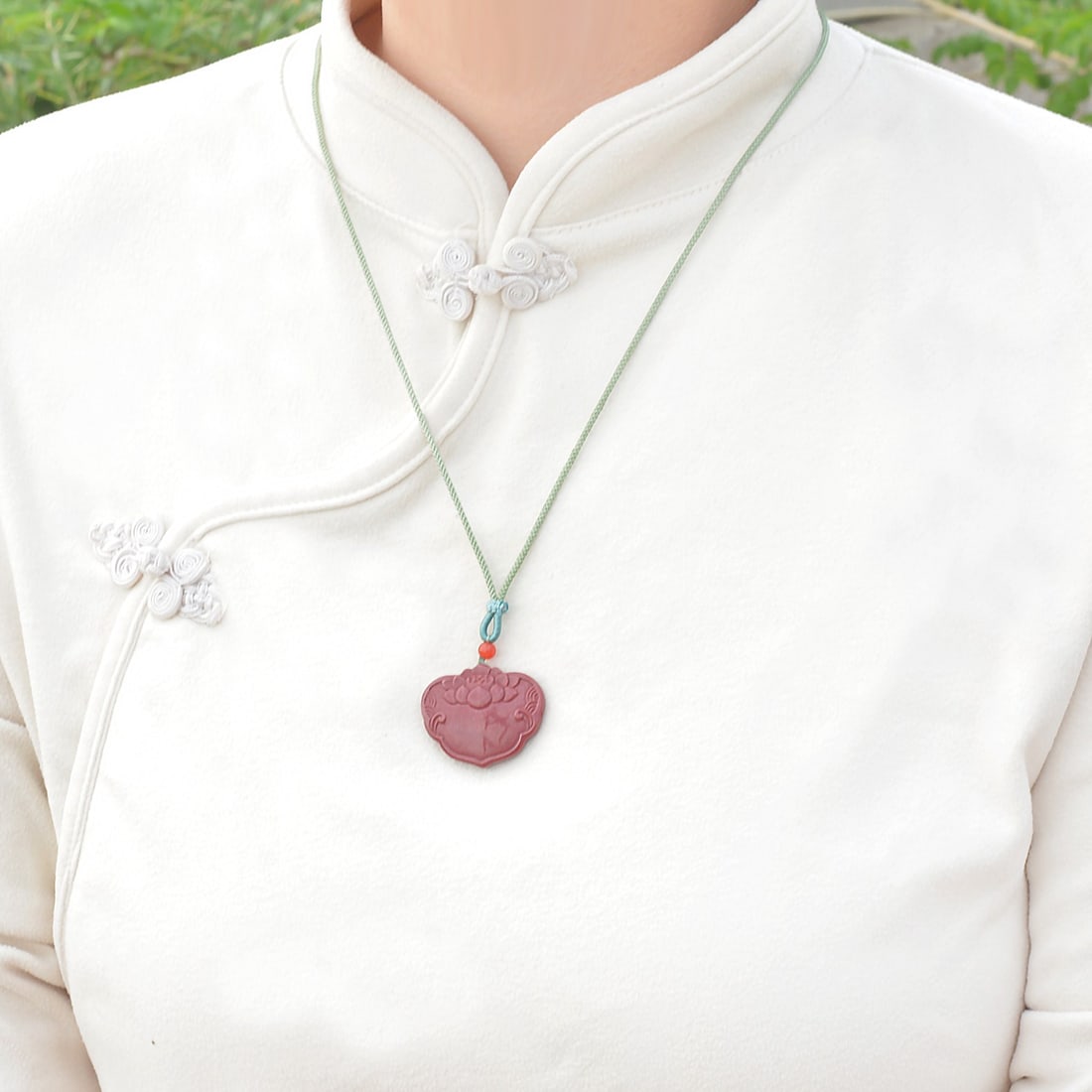 An Exquisite Cinnabar Lotus Pattern Pendant: An Exquisite Cinnabar Lotus Pattern Pendant,Size:0.9inx1.1in,Weight:14.46g 朱砂莲花纹挂件