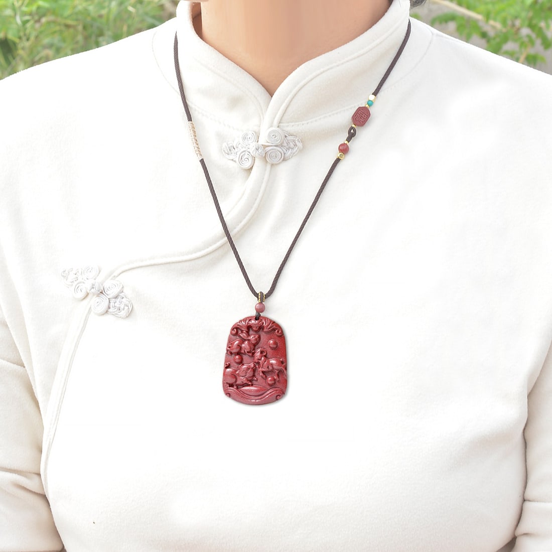 An Exquisite Cinnabar Animal Pattern Pendant: An Exquisite Cinnabar Animal Pattern Pendant,Size:1.2inx1.7in,Weight:31.7g 朱砂动物纹挂件