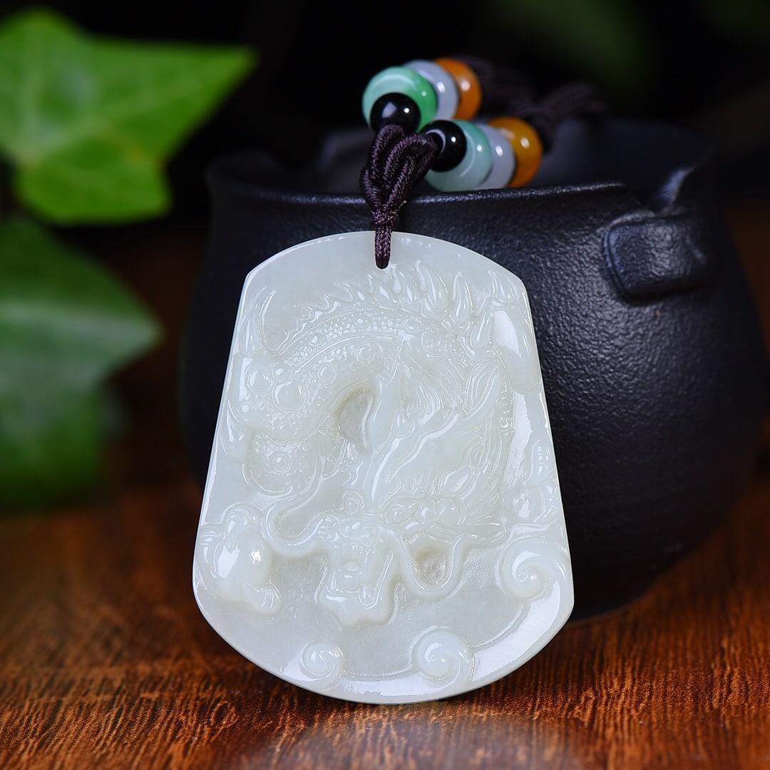 An Exquisite White Jade Dragon Pattern Pendant: An Exquisite White Jade Dragon Pattern Pendant,Size:1.6inx1.9in (寓意)龙行天下 龙腾四海 白玉龙纹牌