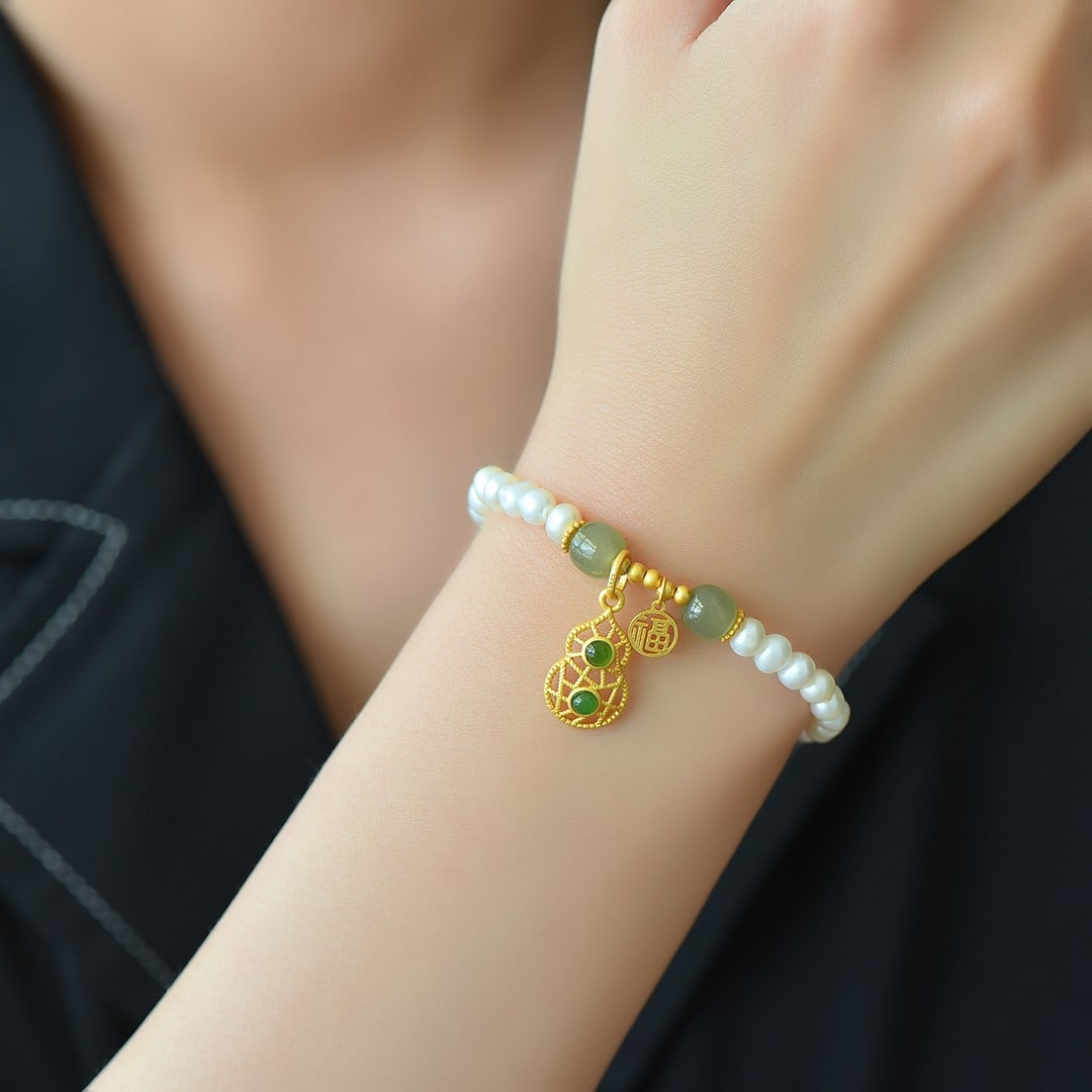 An Exquisite Sterling Silver-Gold Plated Inlaid White Jade Bracelet: An Exquisite Sterling Silver-Gold Plated Inlaid White Jade Bracelet 纯银镀金镶白玉手链