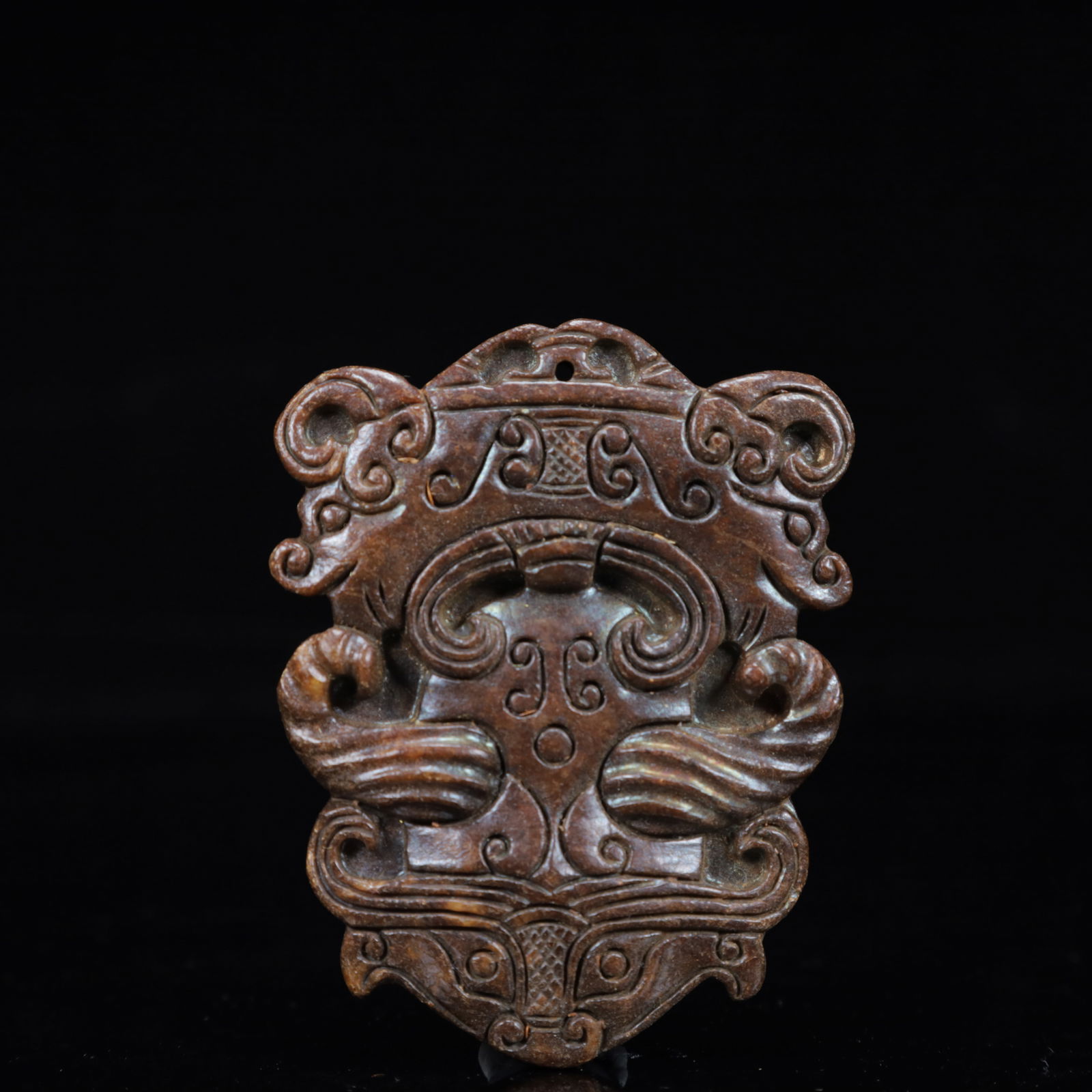 A Rare Gaogu yu Beast-Face Pendant: A Rare Gaogu yu Beast-Face Pendant,Ancient Time,China,Size:2.4inx0.3inx3.1in,Weight:67g 高古玉兽面挂件,中国远古时期