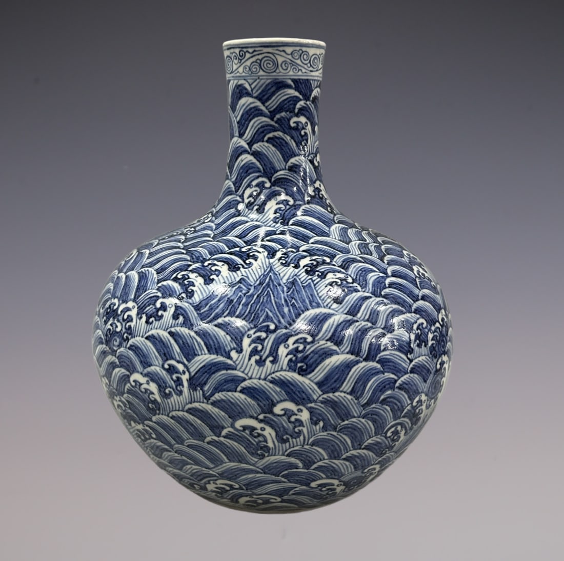 An Exquisite Blue and White Seawater Pattern Vase: An Exquisite Blue and White Seawater Pattern Vase Ming Dynasty, China Size:15.7in青花山河永固纹天球瓶 中国明代