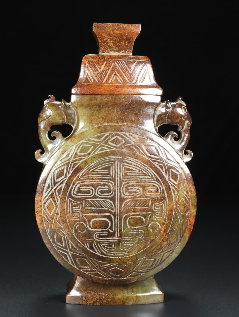 An Exquisite White Jade Beast-Face Pattern Double-Ears Vase: An Exquisite White Jade Beast-Face Pattern Double-Ears Vase S.Zhou , China Size:7.5inx4.2inx2.1in Weight:736.5g白玉兽面纹双耳瓶 商周时