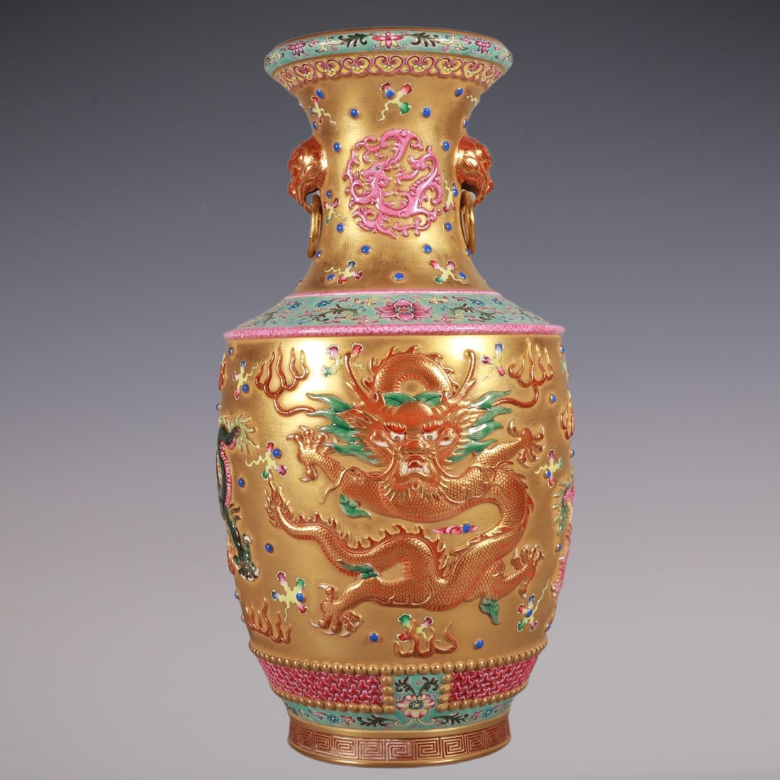 An Exquisite Enamel Lotus Pattern Dragon Pattern Double-Ears Vase: An Exquisite Enamel Lotus Pattern Dragon Pattern Double-Ears Vase Qing Dynasty, China Qianlong Six-character Mark Size:12.6inx6.7in珐琅彩金地龙纹狮ň