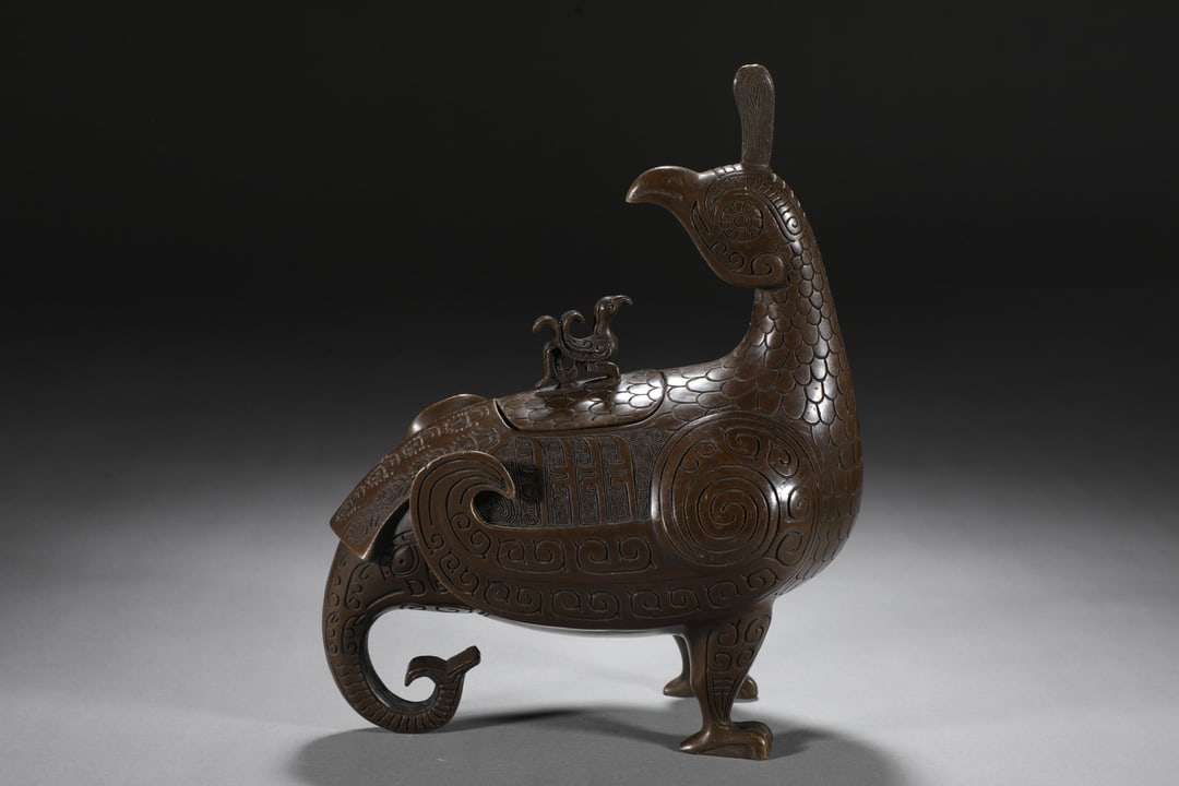 An Exquisite Bronze Bird-Shaped Censer: An Exquisite Bronze Bird-Shaped Censer Qing Dynasty, China Size:7.1inx8.7in Weight:2.65kg铜晋侯鸟尊 中国清代 Size:18cmx22cm Weight:2.65kg