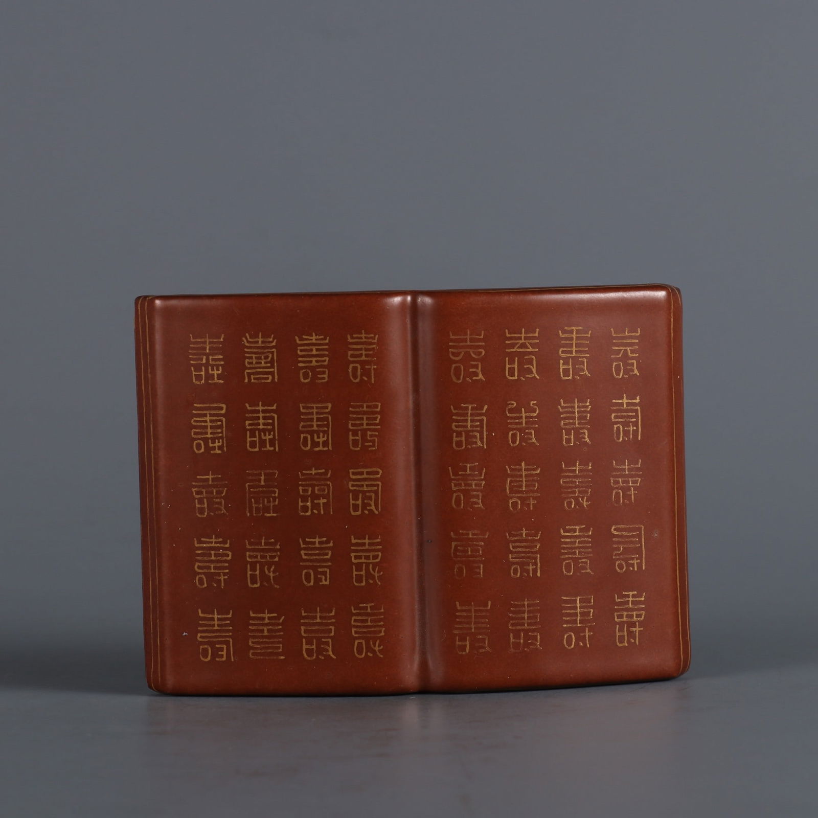 An Exquisite Iron-Red Painted Gold Ornament: An Exquisite Iron-Red Painted Gold Ornament Qing Dynasty, China Size:3.5inx2.6in矾红底描金百寿图书本 中国清代