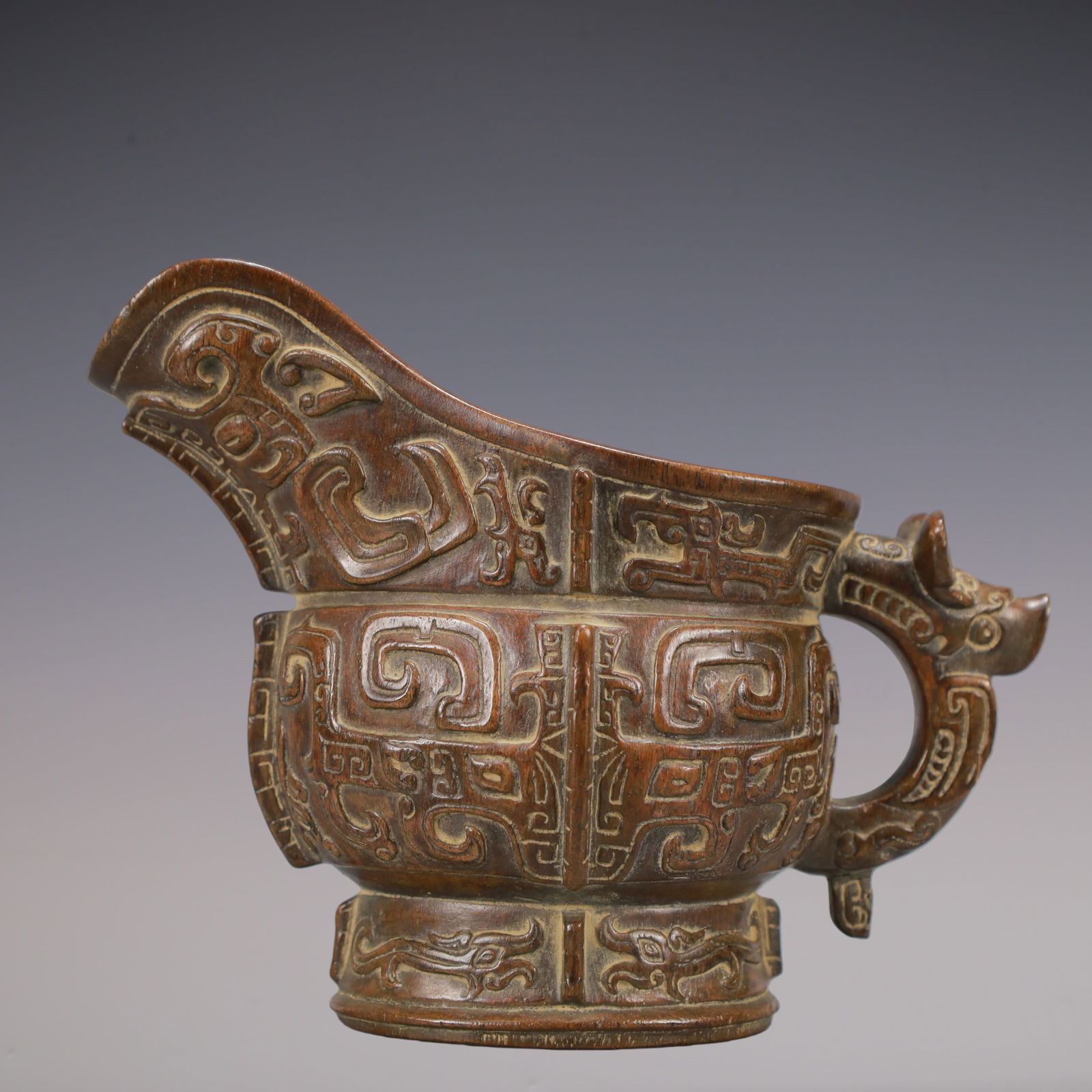 A Exquisite Eaglewood Beast-Face Pattern Goblet: A Exquisite Eaglewood Beast-Face Pattern Goblet Qing Dynasty, China Size:5.1inx3in Weight:150g沉香木兽面纹爵杯 中国清代 Size:13c