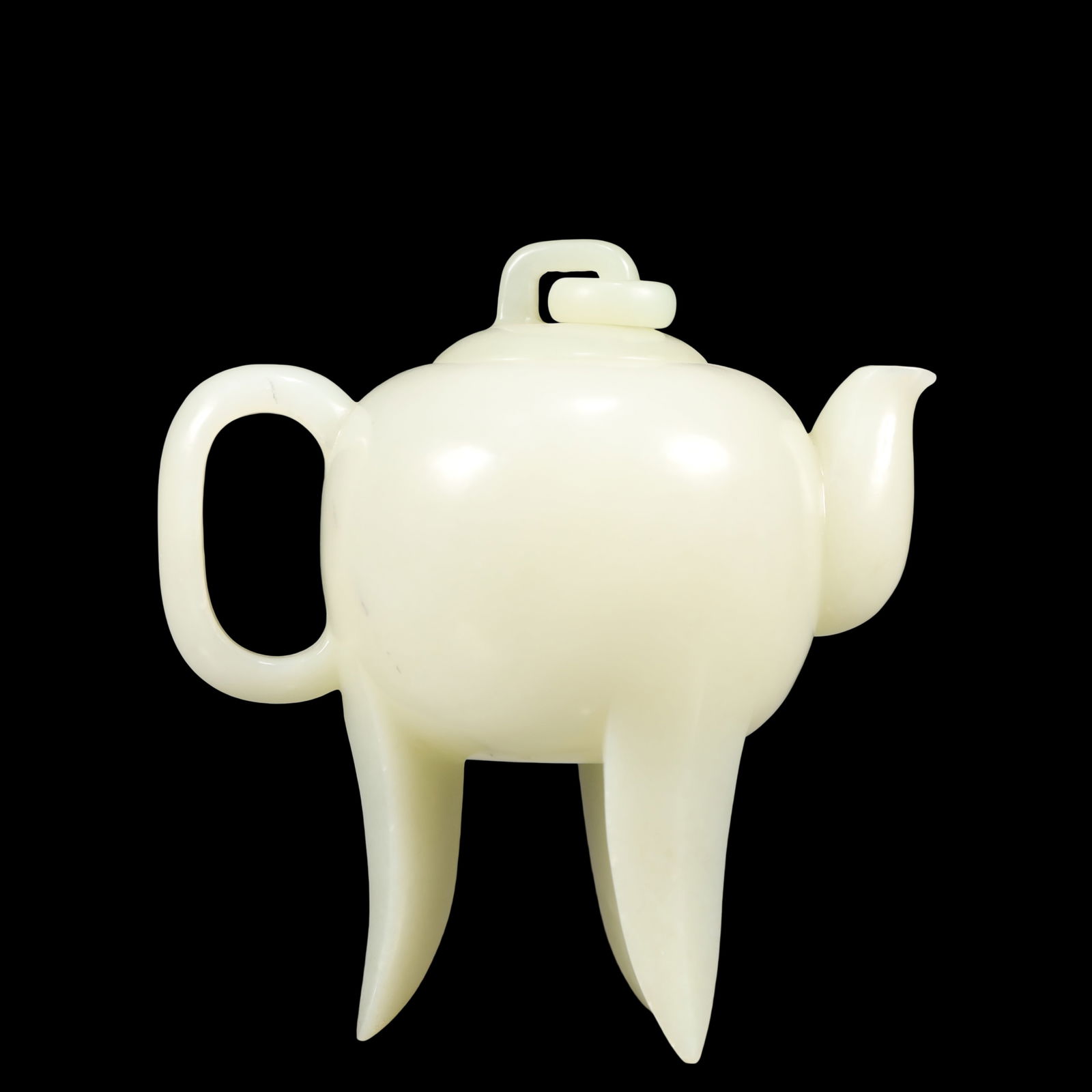 A Exquisite White Jade Teapot: A Exquisite White Jade Teapot Qing Dynasty, China Size:5.5inx3.1inx5.7in Weight:400g白玉茶壶 中国清代 Size:14cmx8cmx14.5cm Weight:400g