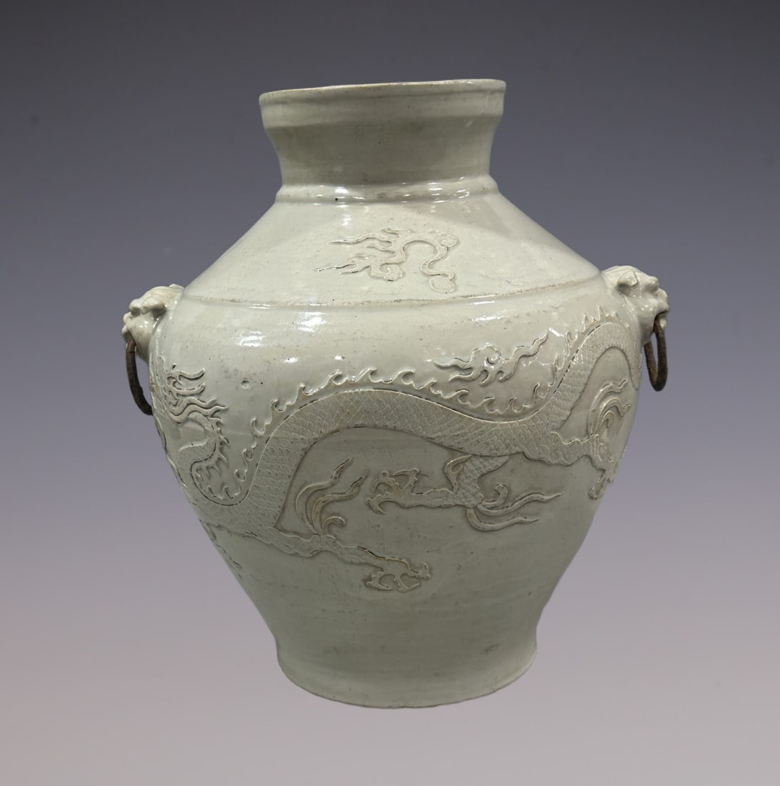 An Exquisite Shufu Glazed Dragon Pattern Double-Ears Jar: An Exquisite Shufu Glazed Dragon Pattern Double-Ears Jar Yuan Dynasty, China Size:15.7in枢府窑卵白釉龙纹瓶罐