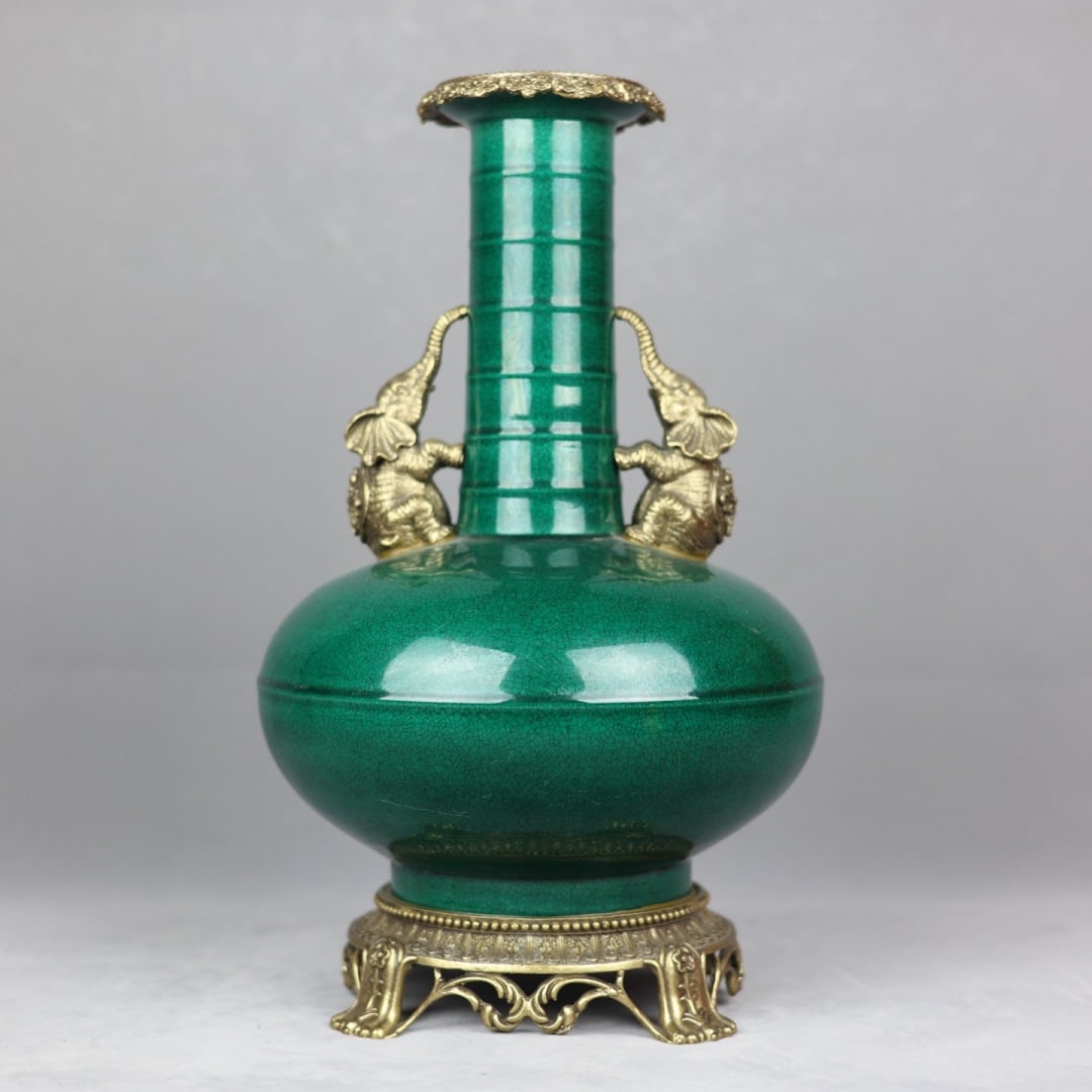 An Exquisite Green Glazed Inlaid Bronze Double-Ears Vase: An Exquisite Green Glazed Inlaid Bronze Double-Ears Vase Qing Dynasty, China Kangxi Six-character Mark Size:14.8inx8.7in郎窑绿釉象耳弦纹瓶