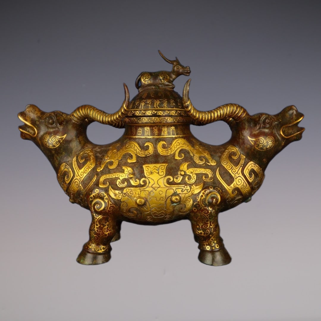 An Exquisite Bronze Inlaid Gold Beast-Face Pattern With Inscription Censer: An Exquisite Bronze Inlaid Gold Beast-Face Pattern With Inscription Censer W.Zhou , China Size:24.4inx17.3in Weight:10500g青铜错金双牛尊