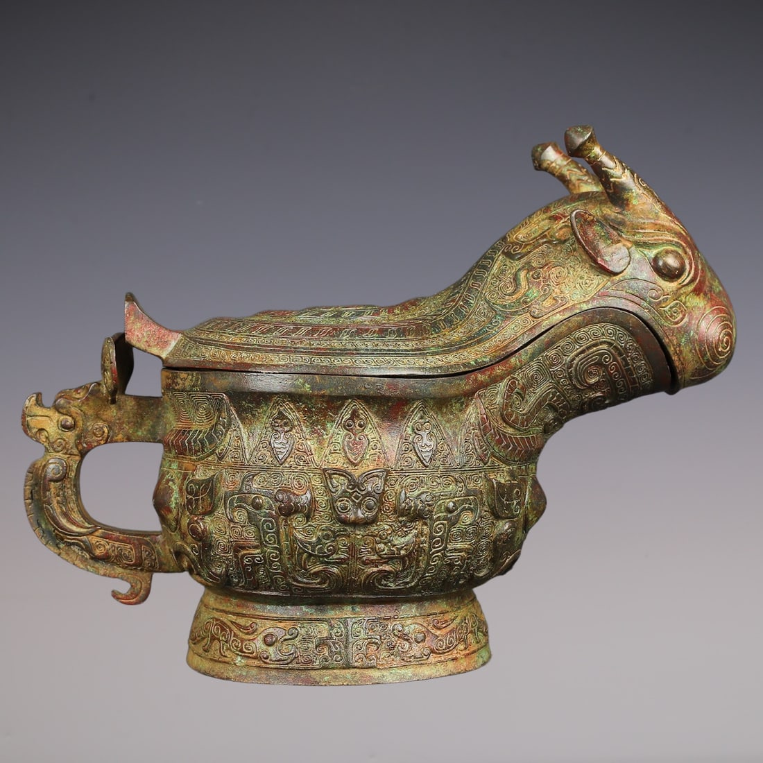 An Exquisite Bronze Beast-Face Pattern Ewer: An Exquisite Bronze Beast-Face Pattern Ewer W.Zhou , China Size:12.6inx9.4in Weight:3850g青铜兽觥 西周时期 Size:32cmx24cm Weight:3850g