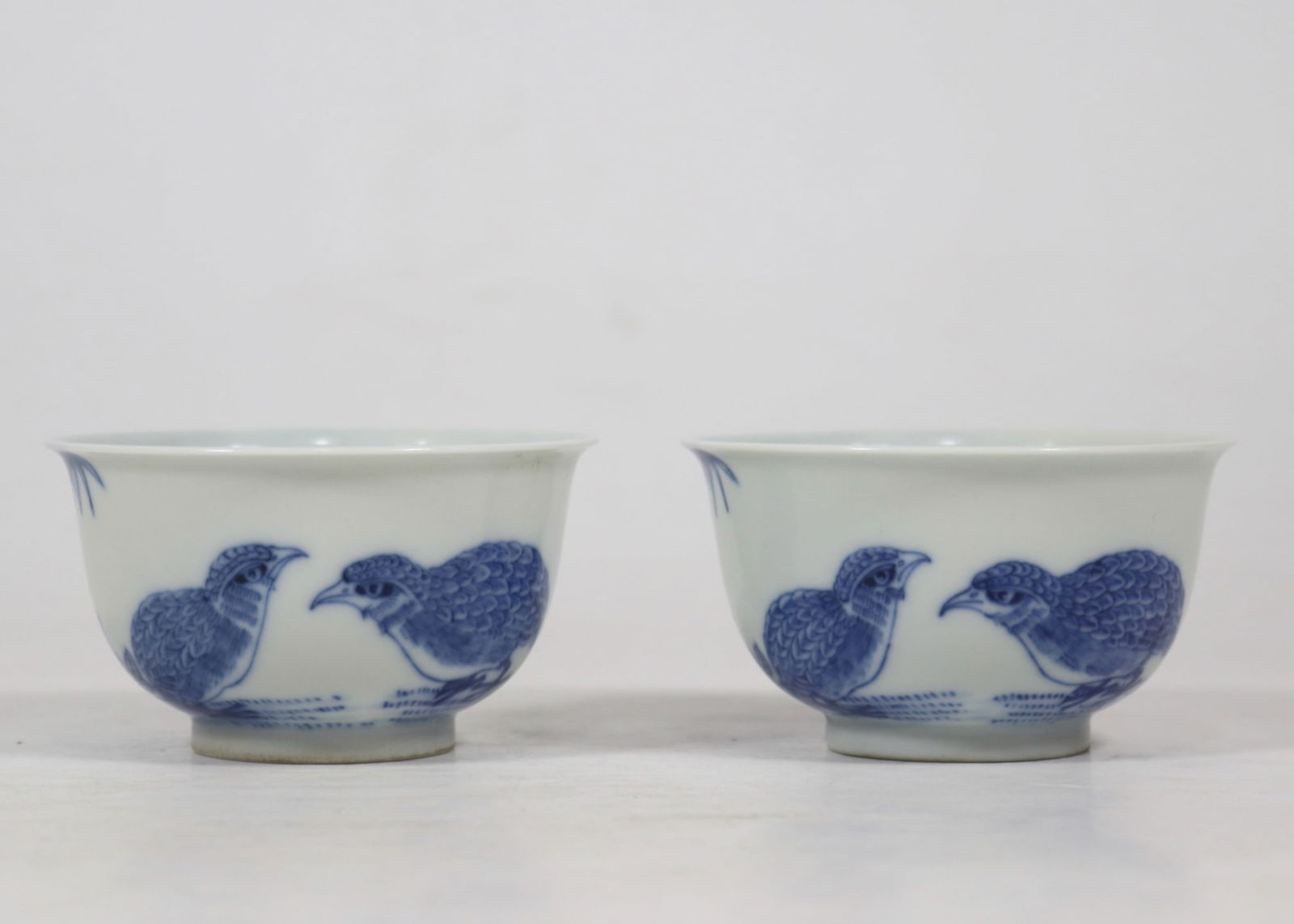A Pair of Exquisite Blue and White Flower and Bird Pattern Cup: A Pair of Exquisite Blue and White Flower and Bird Pattern Cup Qing Dynasty, China Yongzheng Six-character Mark Size:1.8inx3.1in青花鹌鹑对杯