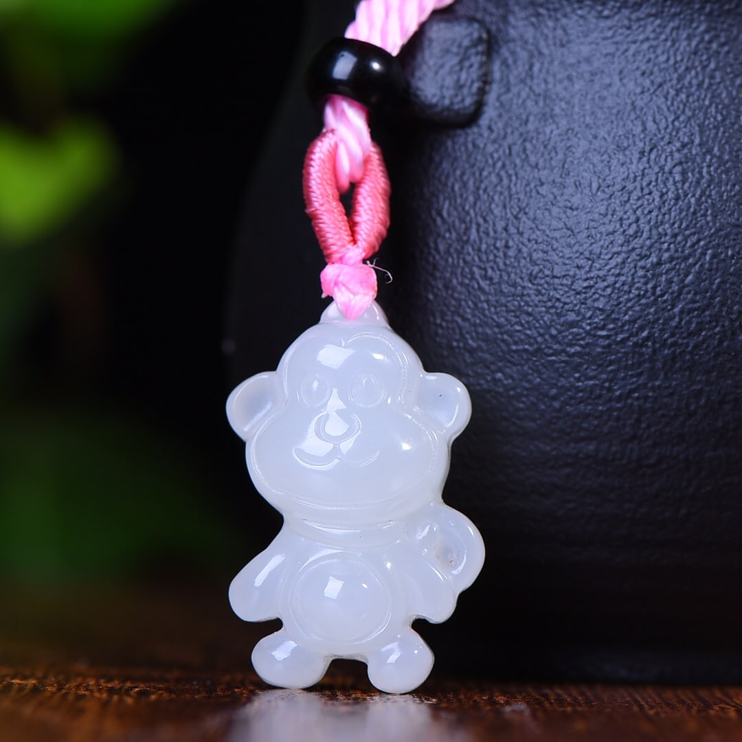 An Exquisite White Jade Monkey Pendant: An Exquisite White Jade Monkey Pendant,Size:15mmx26mm (寓意)卡通可爱 白玉猴吊坠