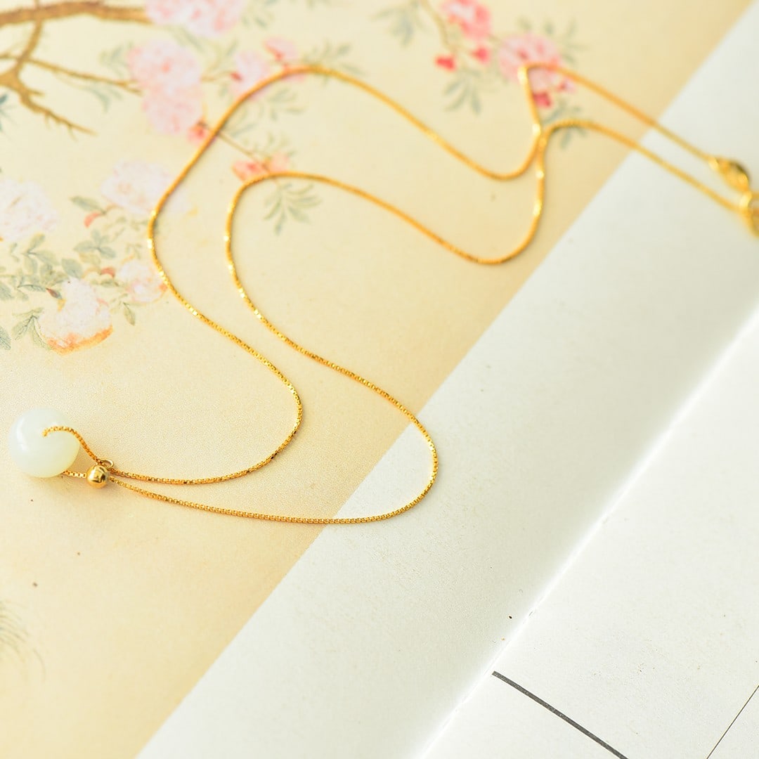 An Exquisite Sterling Silver-Gold Plated Inlaid White Jade Pendant: An Exquisite Sterling Silver-Gold Plated Inlaid White Jade Pendant 纯银镀金镶白玉吊坠