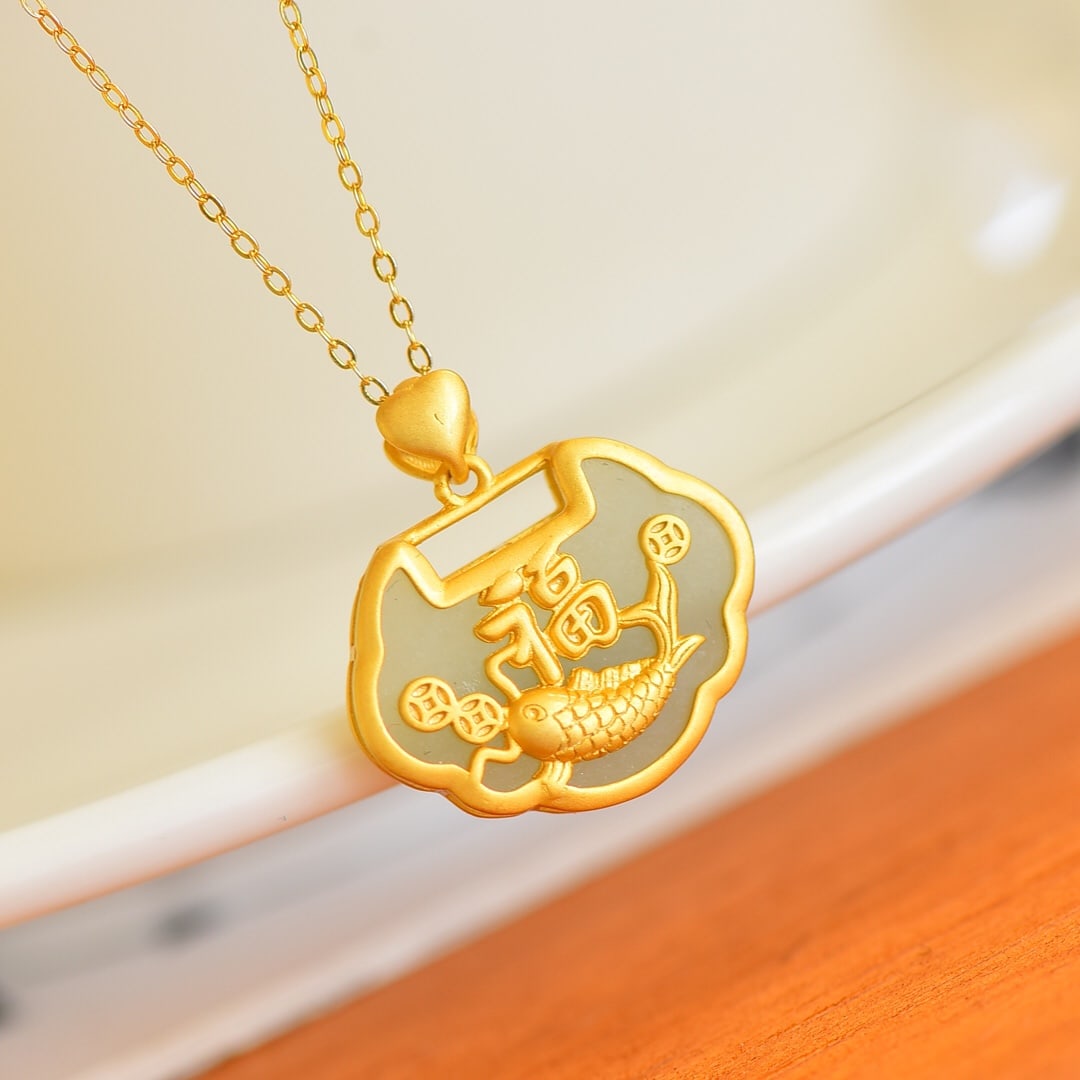 An Exquisite Sterling Silver-Gold Plated Inlaid White Jade Pendant: Sterling Silver-Gold Plated Inlaid White Jade Pendant , Size :15mmx20mm 纯银镀金镶白玉吊坠,尺寸:15mmx20mm