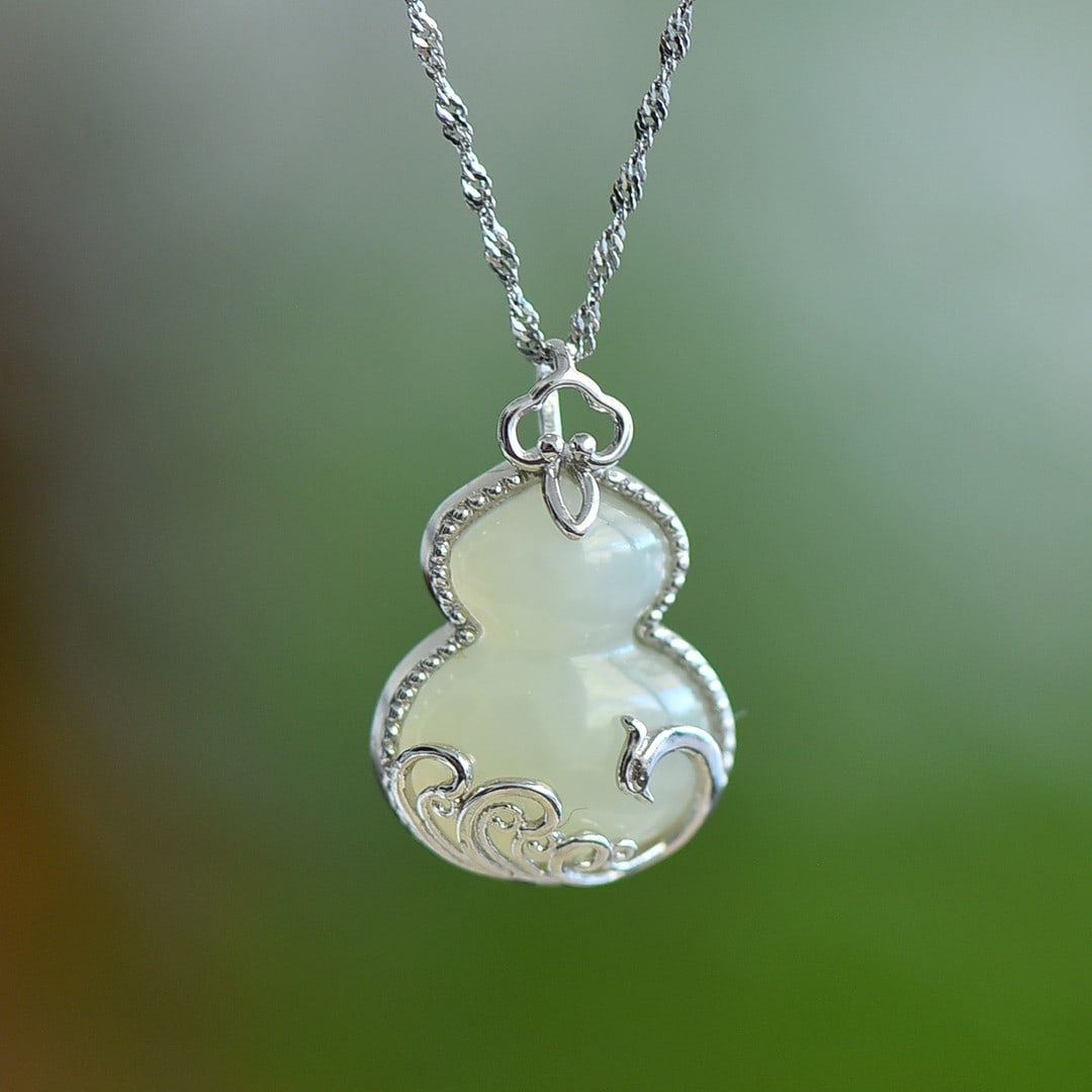An Exquisite Sterling Silver Inlaid White Jade Gourd Pendant: An Exquisite Sterling Silver Inlaid White Jade Gourd Pendant 纯银镶白玉葫芦吊坠