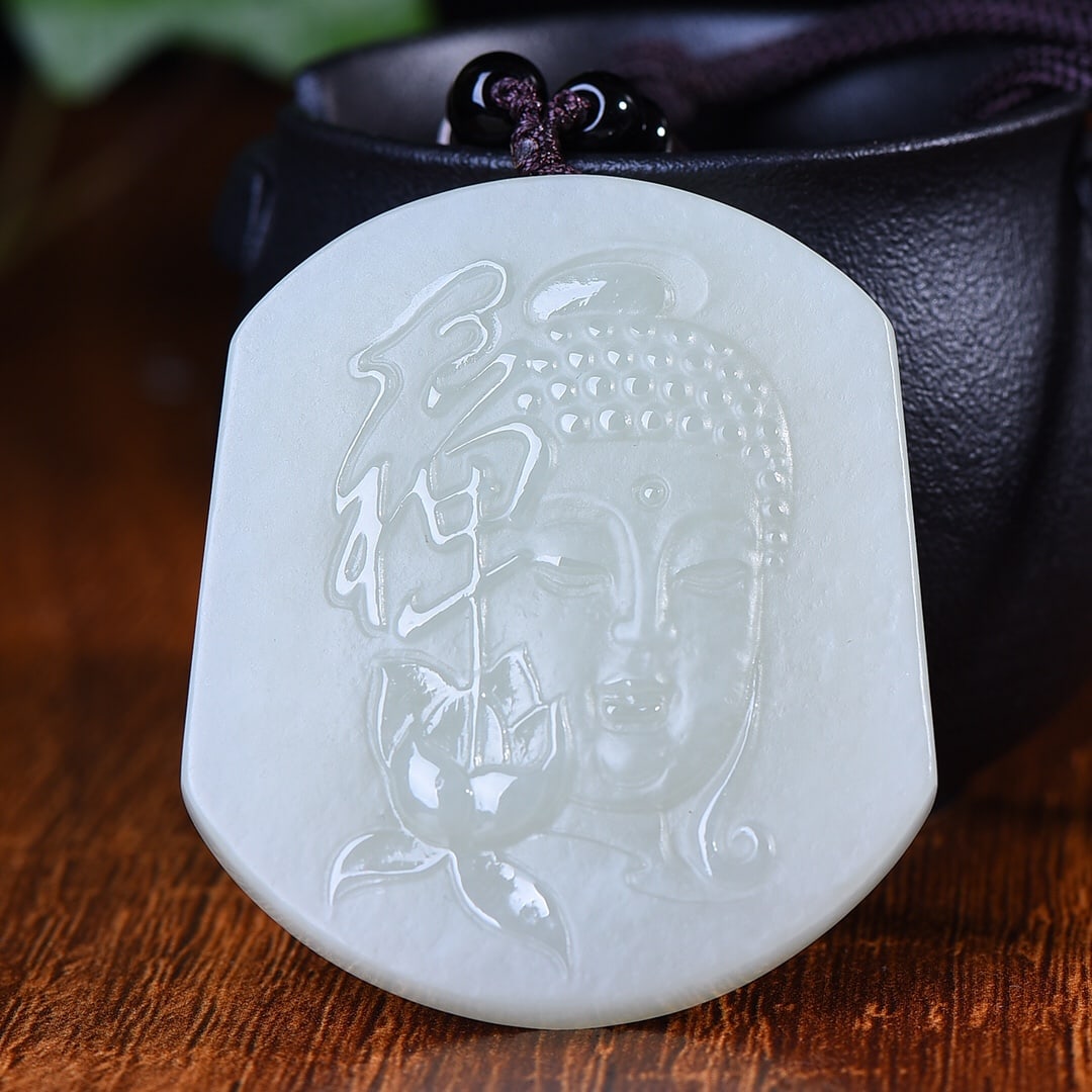 An Exquisite White Jade Buddha Pattern Pendant: An Exquisite White Jade Buddha Pattern Pendant,Size:54mmx48mm (寓意)可以开拓我们的心灵 