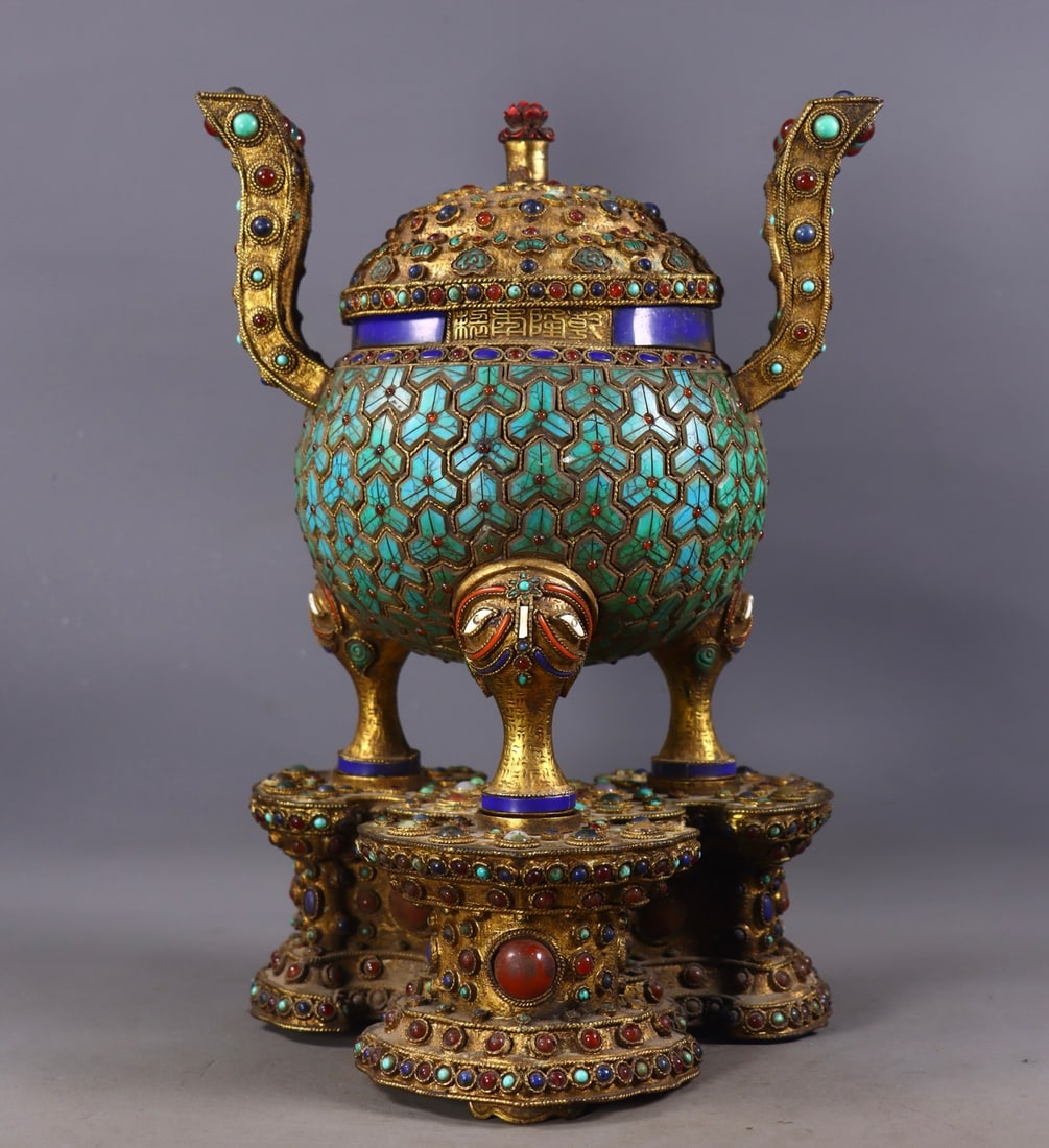An Exquisite Gilt Bronze Double-Ears and Tripod Censer,Inlaid Gems,With Base: An Exquisite Gilt Bronze Double-Ears and Tripod Censer,Inlaid Gems,With Base,Qing Dynasty, China,Qianlong Four-character Mark,Size:11.8in,(Base)3.3inx7.5in,(Censer)8.7inx8.3inx5.5in,Weight:3583g 