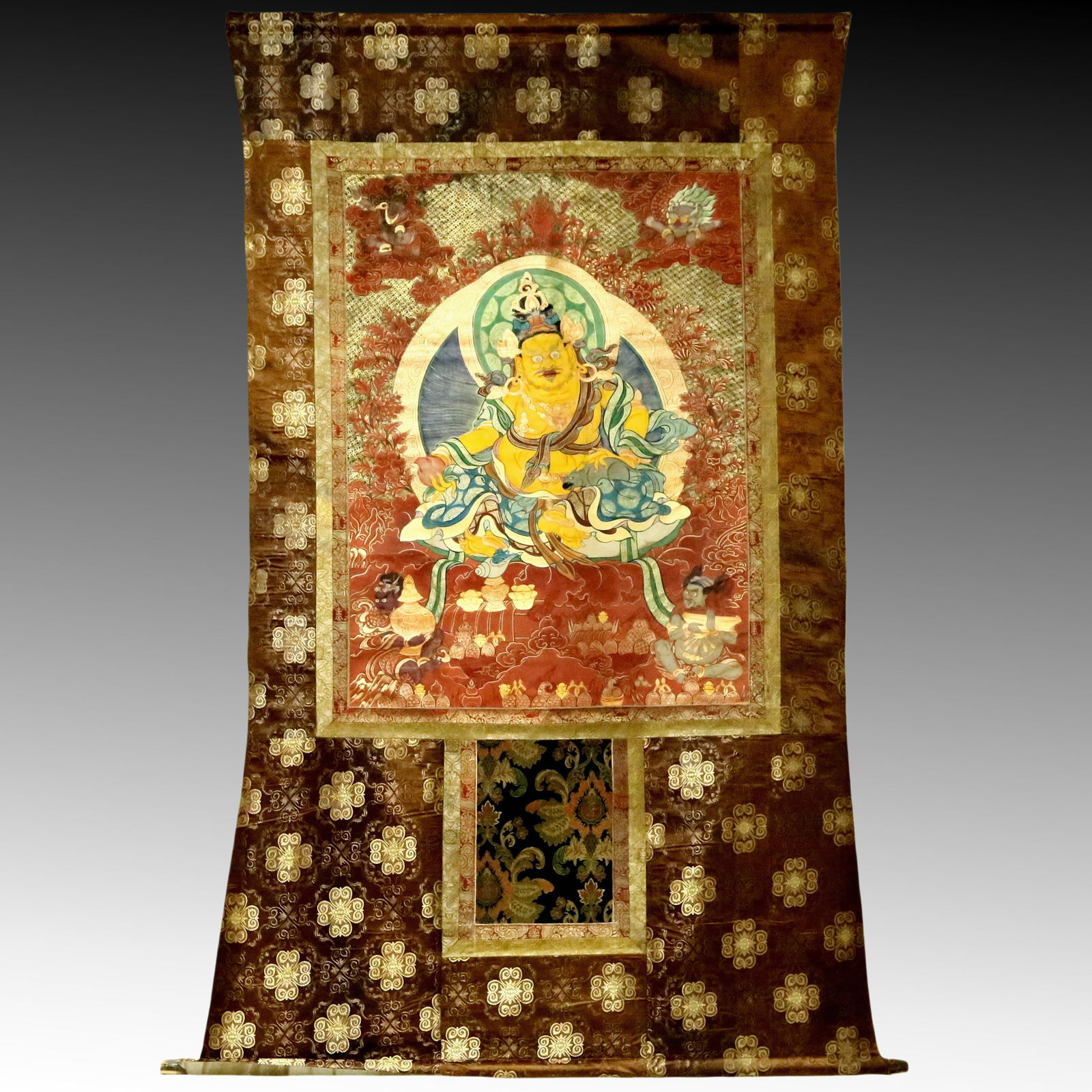 An Exquisite Brocade Painted Color Statue of Mammon Tangka: An Exquisite Brocade Painted Color Statue of Mammon Tangka,Qing Dynasty, China,Size:47.2inx74.8in 织锦彩绘财神像唐卡，清代