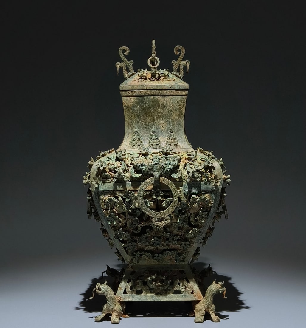 An Archaic Bronze Hollow Plum Blossom Pattern Beast-Ears Cover Pot (1 of 9)