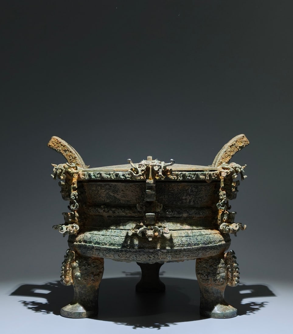 An Archaic Bronze Cloud and Thunder Pattern Double-Ears and Tripod Censer,With Inscription: An Archaic Bronze Cloud and Thunder Pattern Double-Ears and Tripod Censer,With Inscription,the Warring States period in China,Size:11inx13inx10.2in 