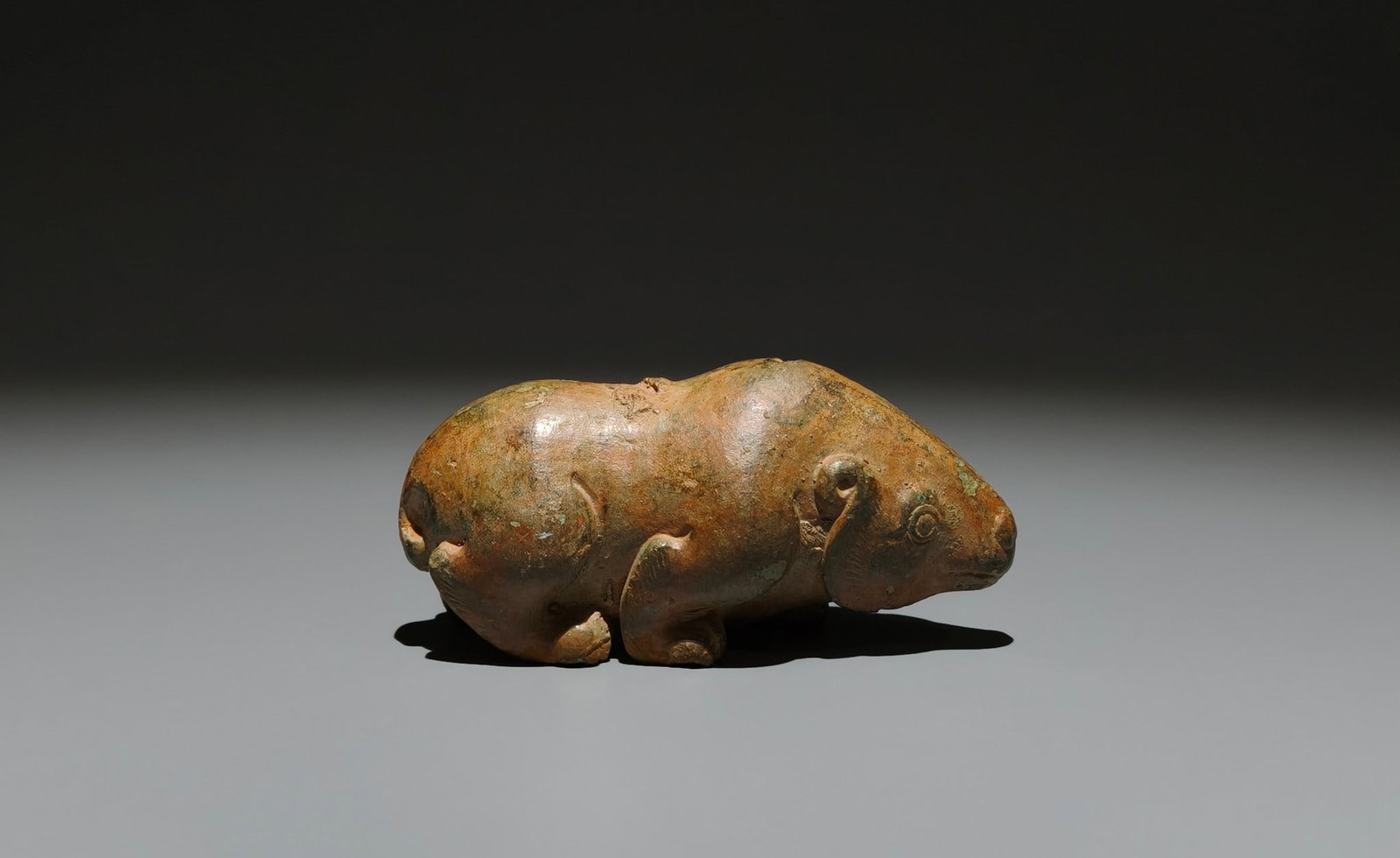 An Archaic Bronze Auspicious Beast Ornament: An Archaic Bronze Auspicious Beast Ornament,Han Dynasty, China,Size:1.8inx3.5inx1.4in 青铜瑞兽摆件,中国汉代