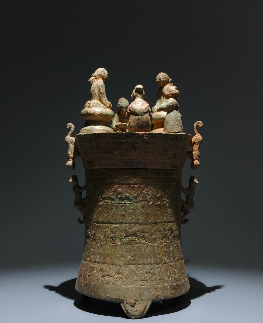 An Archaic Bronze Hunting Pattern Tripod Ornament,With Inscription,With Figure Cover: An Archaic Bronze Hunting Pattern Tripod Ornament,With Inscription,With Figure Cover,the Warring States period in China,Size:15inx7.5in 