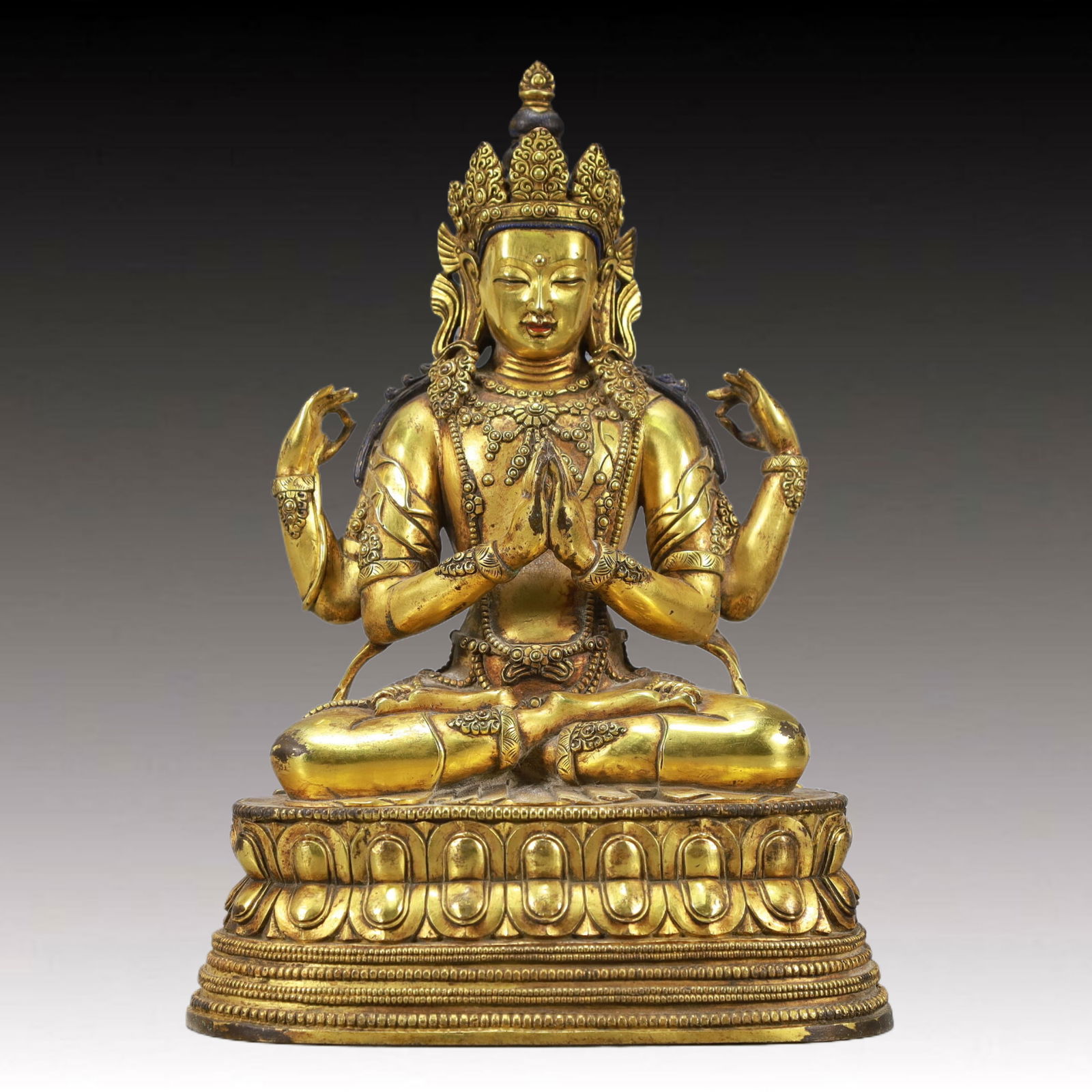 A Solemn Gilt Bronze Statue of Four-arms Guanyin: A Solemn Gilt Bronze Statue of Four-arms Guanyin,Qing Dynasty, China,Size:7.9inx3.9inx7.1in,Weight:4150g 