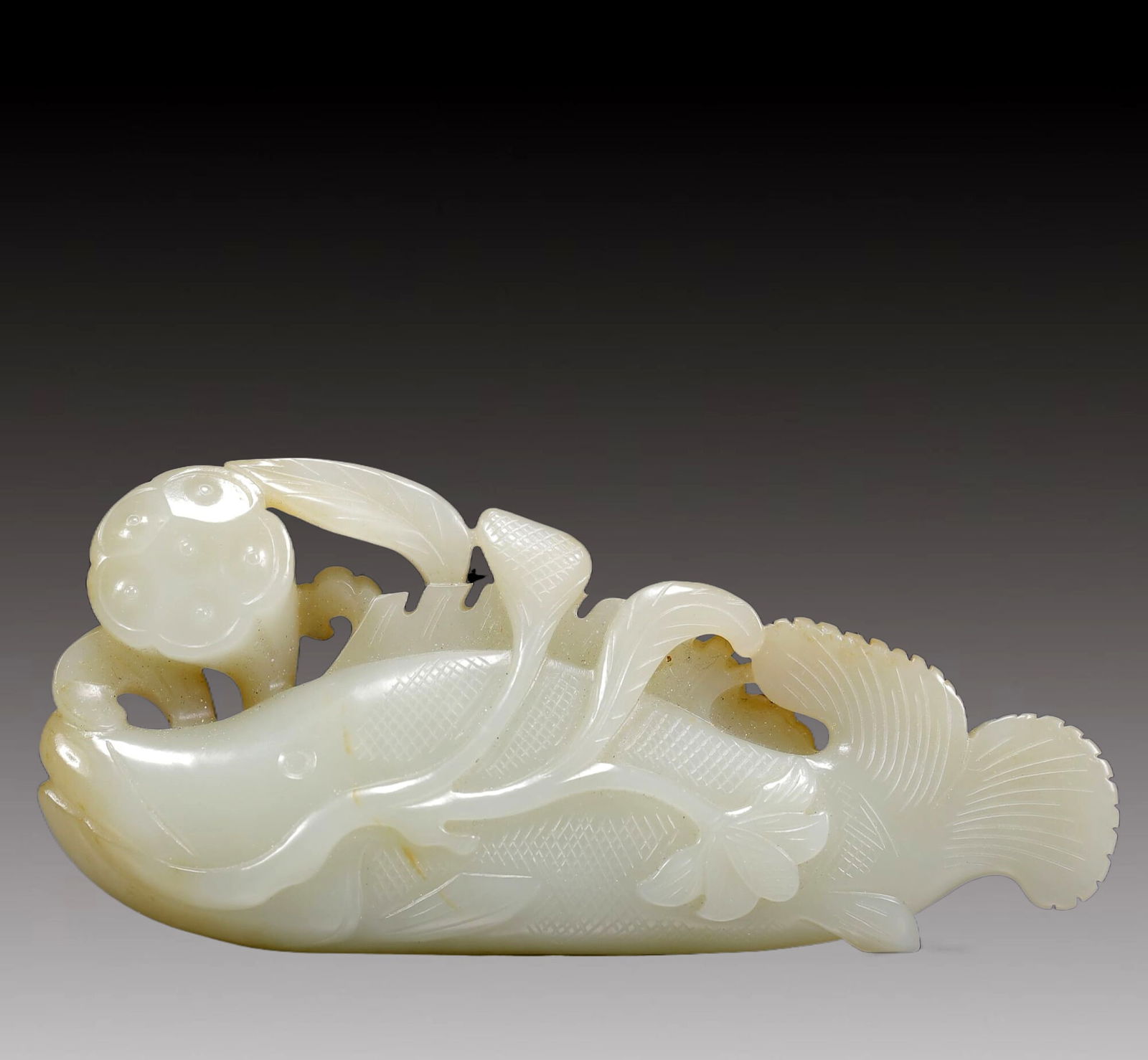 An Exquisite Greenish Jade Fish Ornament (1 of 8)