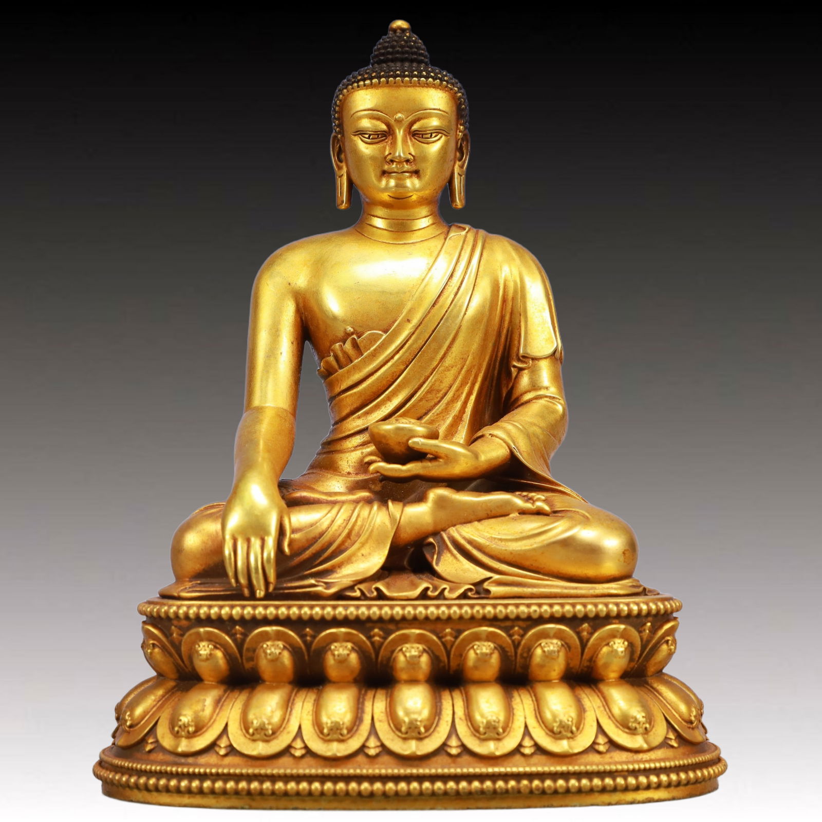 A Solemn Gilt Bronze Statue of Sakyamuni: A Solemn Gilt Bronze Statue of Sakyamuni,Ming Dynasty, China,Yongle Six-character Mark,Size:6.3inx4.3inx7.9in,Weight:3700g 