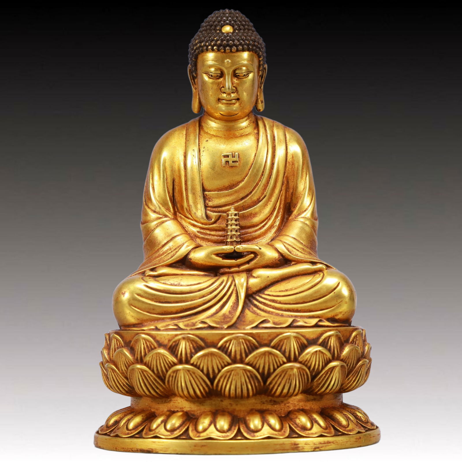 A Solemn Gilt Bronze Statue of Sakyamuni: A Solemn Gilt Bronze Statue of Sakyamuni,Ming Dynasty, China,Yongle Six-character Mark,Size:4.1inx3.3inx6.3in,Weight:2050g 
