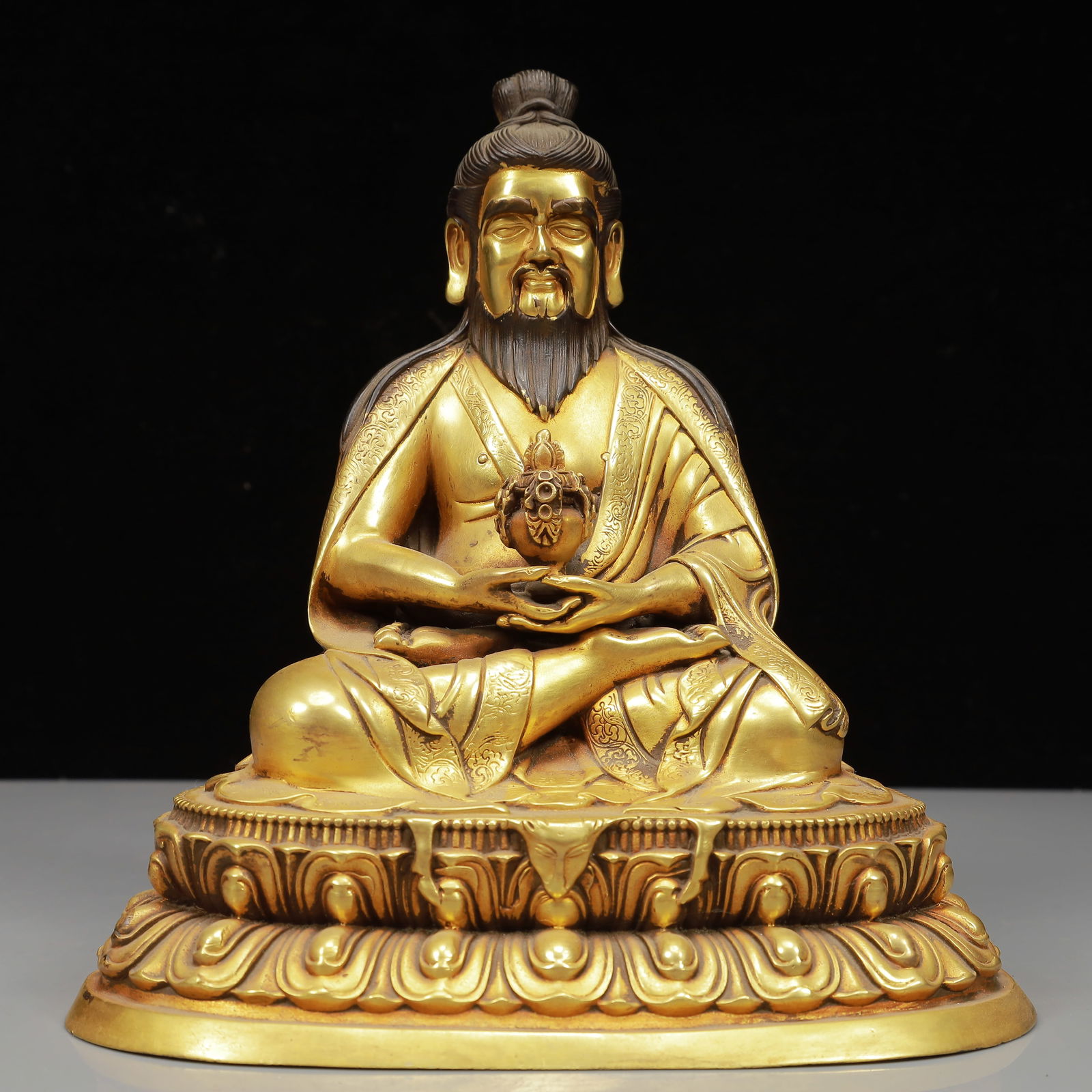 A Solemn Gilt Bronze Statue of Guru: A Solemn Gilt Bronze Statue of Guru,Qing Dynasty, China,Size:7.9inx5.5inx8.7in,Weight:2950g 铜鎏金上师像,中国清代