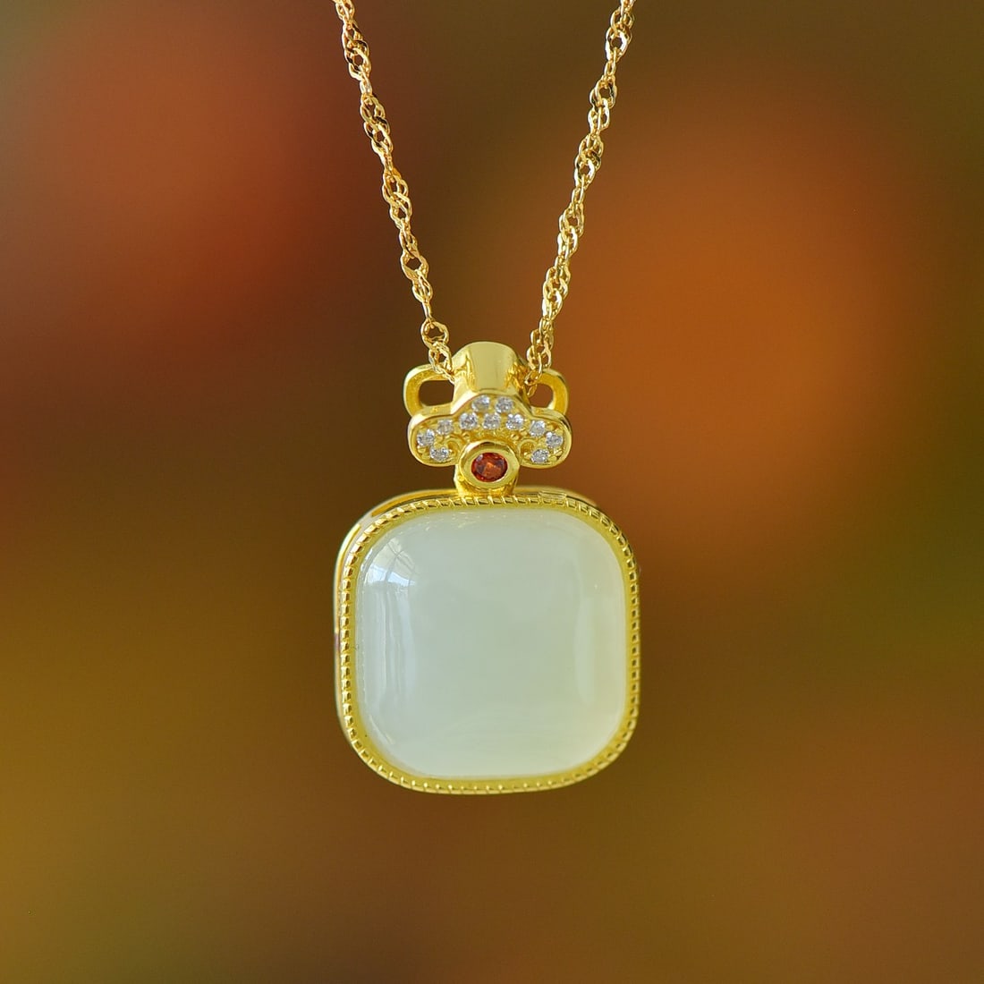 An Exquisite Sterling Silver-Gold Plated Inlaid White Jade Pendant: An Exquisite Sterling Silver-Gold Plated Inlaid White Jade Pendant 纯银镀金镶白玉吊坠