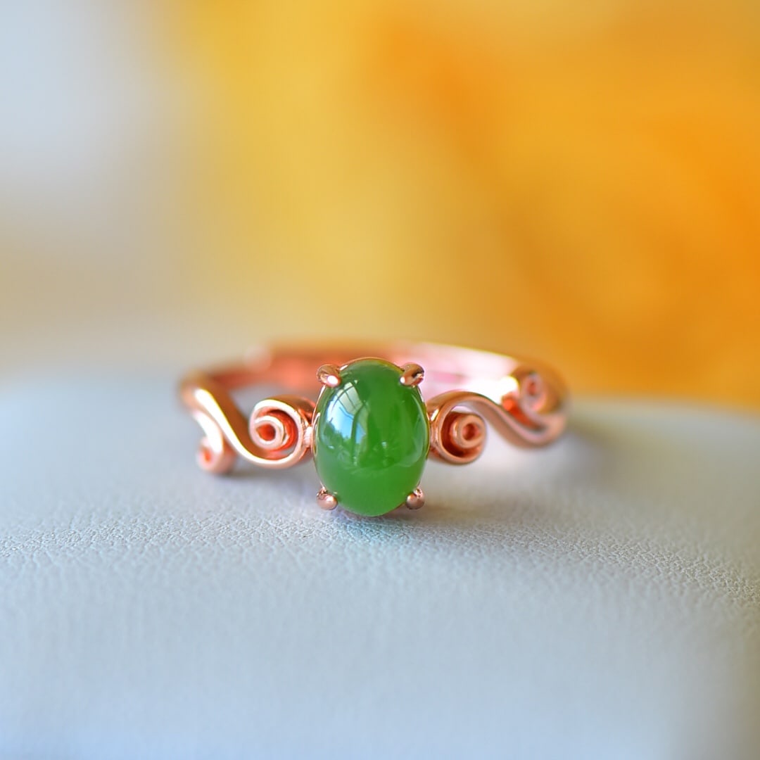 An Exquisite Sterling Silver-Gold Plated Inlaid White Jade Ring: Sterling Silver-Gold Plated Inlaid White Jade Ring , Size :6mmx8mm 纯银镀金镶白玉戒指,尺寸:6mmx8mm