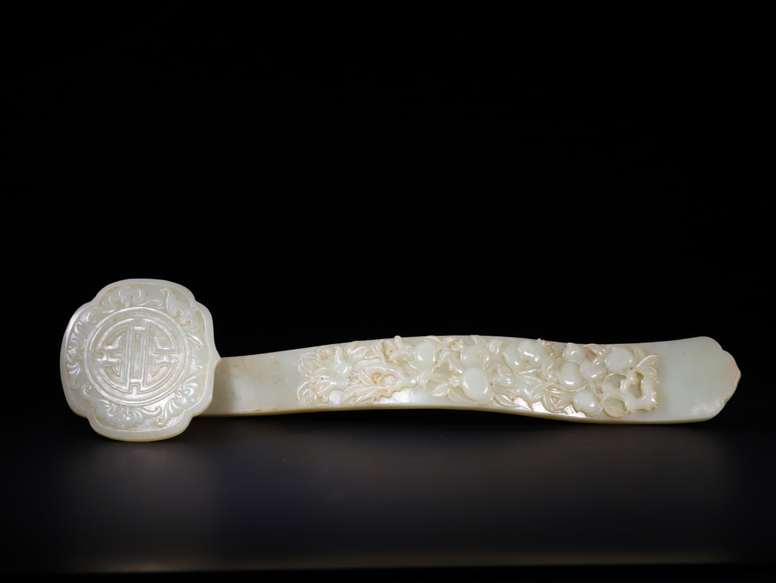 A Exquisite Hotan Jade Ruyi Ornament: A Exquisite Hotan Jade Ruyi Ornament,Qing Dynasty, China,Size:37cmx9.3cmx5.4cmx4.6cmx1.6cm,Weight:623g ????????,????