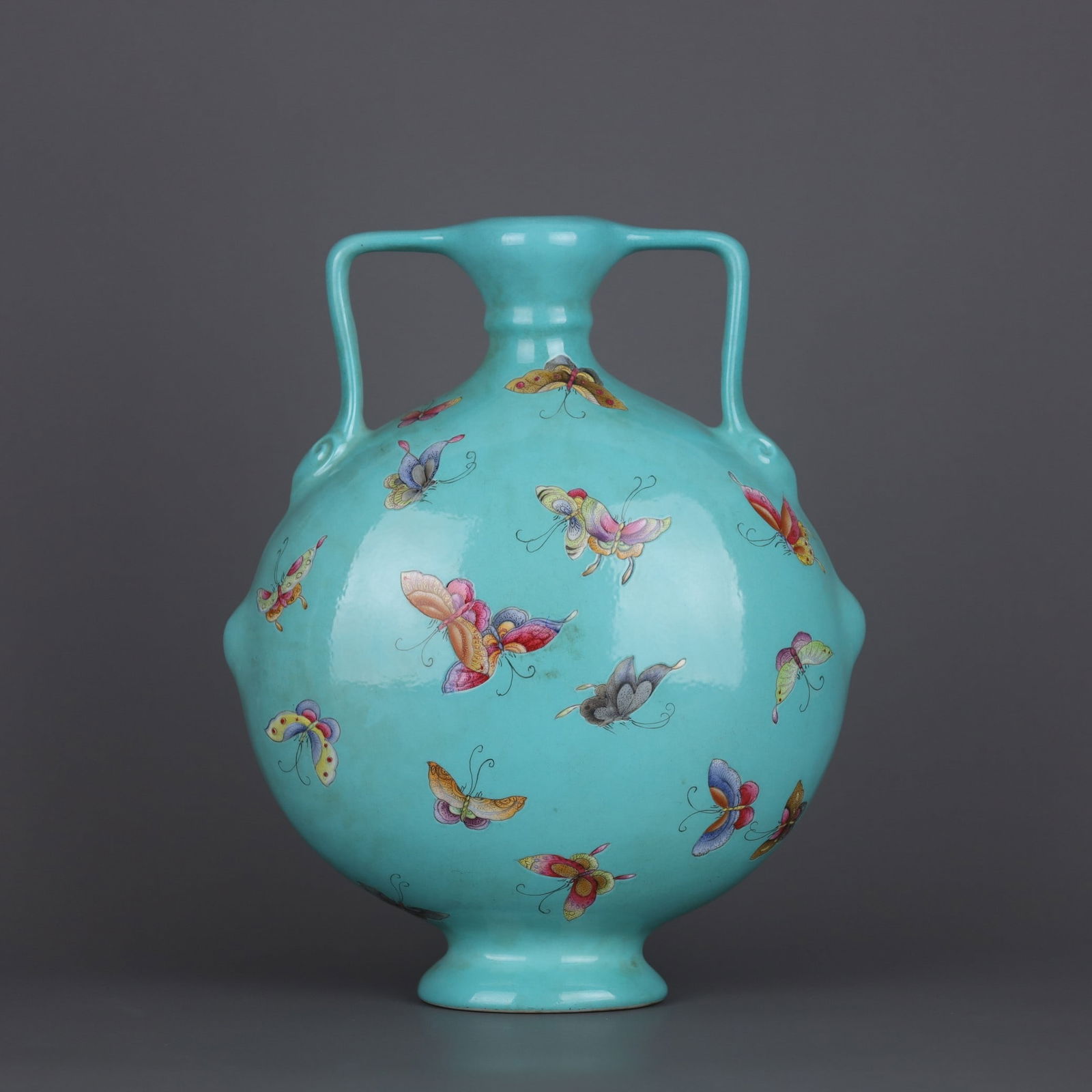A Exquisite Turquoise-Glazed Famille-Rose Butterfly Pattern Ruyi Ears Vase: A Exquisite Turquoise-Glazed Famille-Rose Butterfly Pattern Ruyi Ears Vase,Qing Dynasty, China,Qianlong Six-character Mark,Size:23.6cmx20cm ?????????????????,????,?????